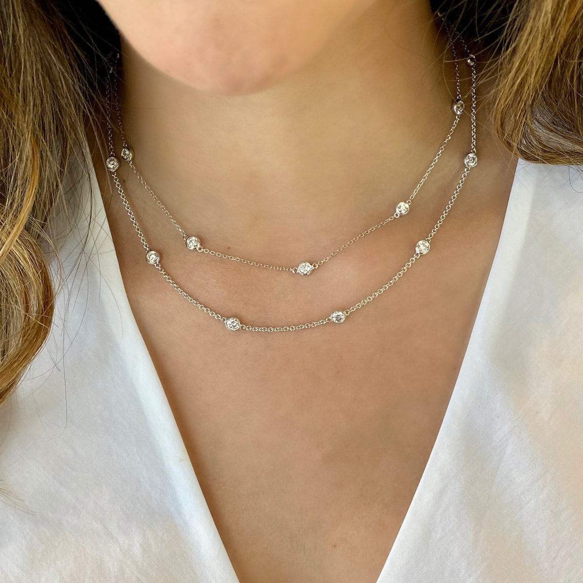 Female Model Wearing Diamonds by the Yard Necklace  - 14K gold weighing 8.30 grams  - 12 round diamonds totaling 2.95 carats