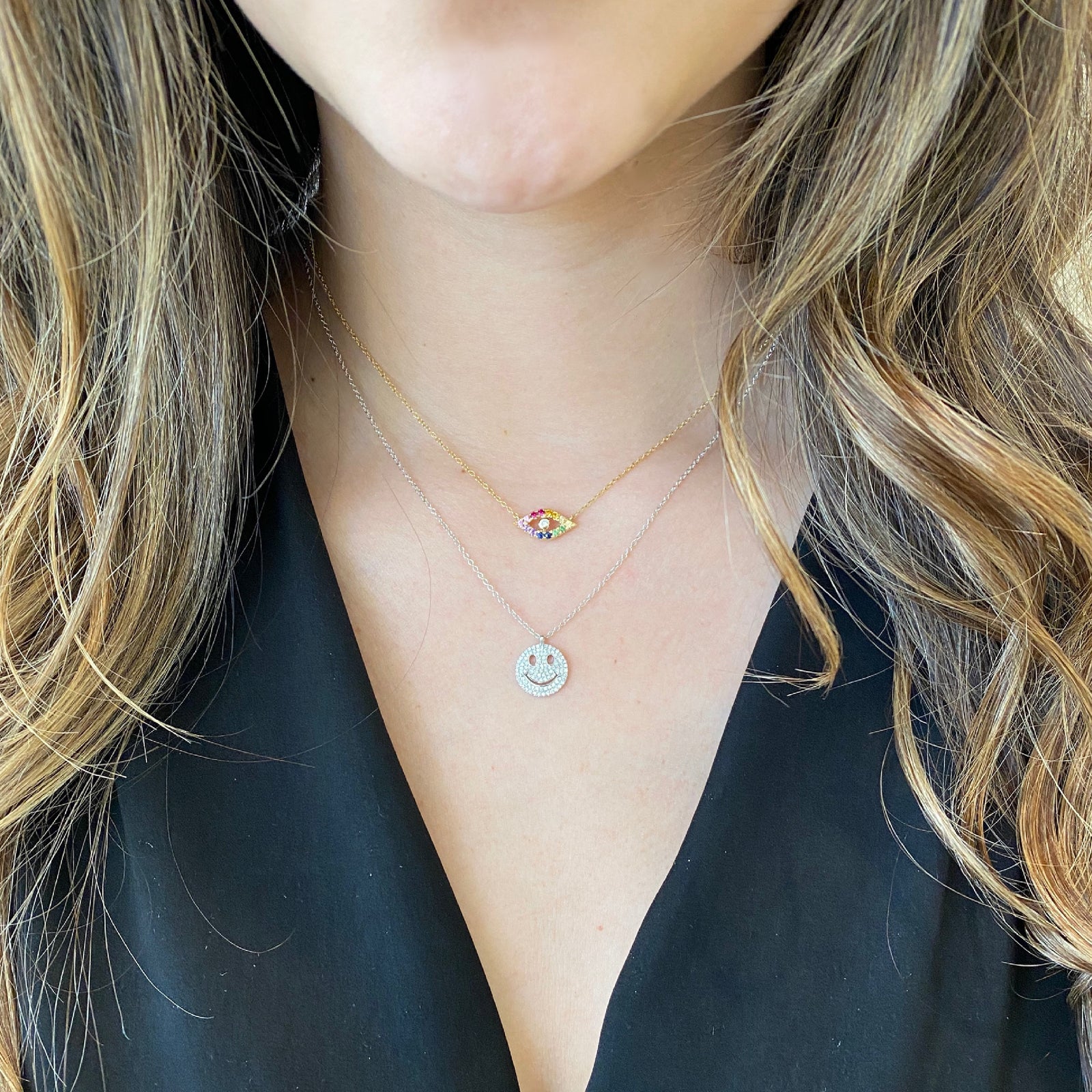 Solid 14K yellow gold weighing 2.40 grams with 101 round prong-set diamonds weighing .24 carats Smiley Face Necklace | Nuha Jewelers
