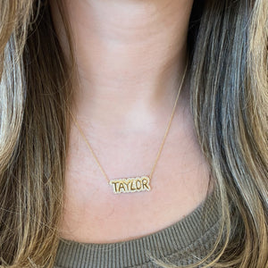 Female Model Wearing Diamond Bubble Nameplate Necklace  - 14K gold weighing 5.41 grams  - 82 round diamonds weighing 0.40 carats