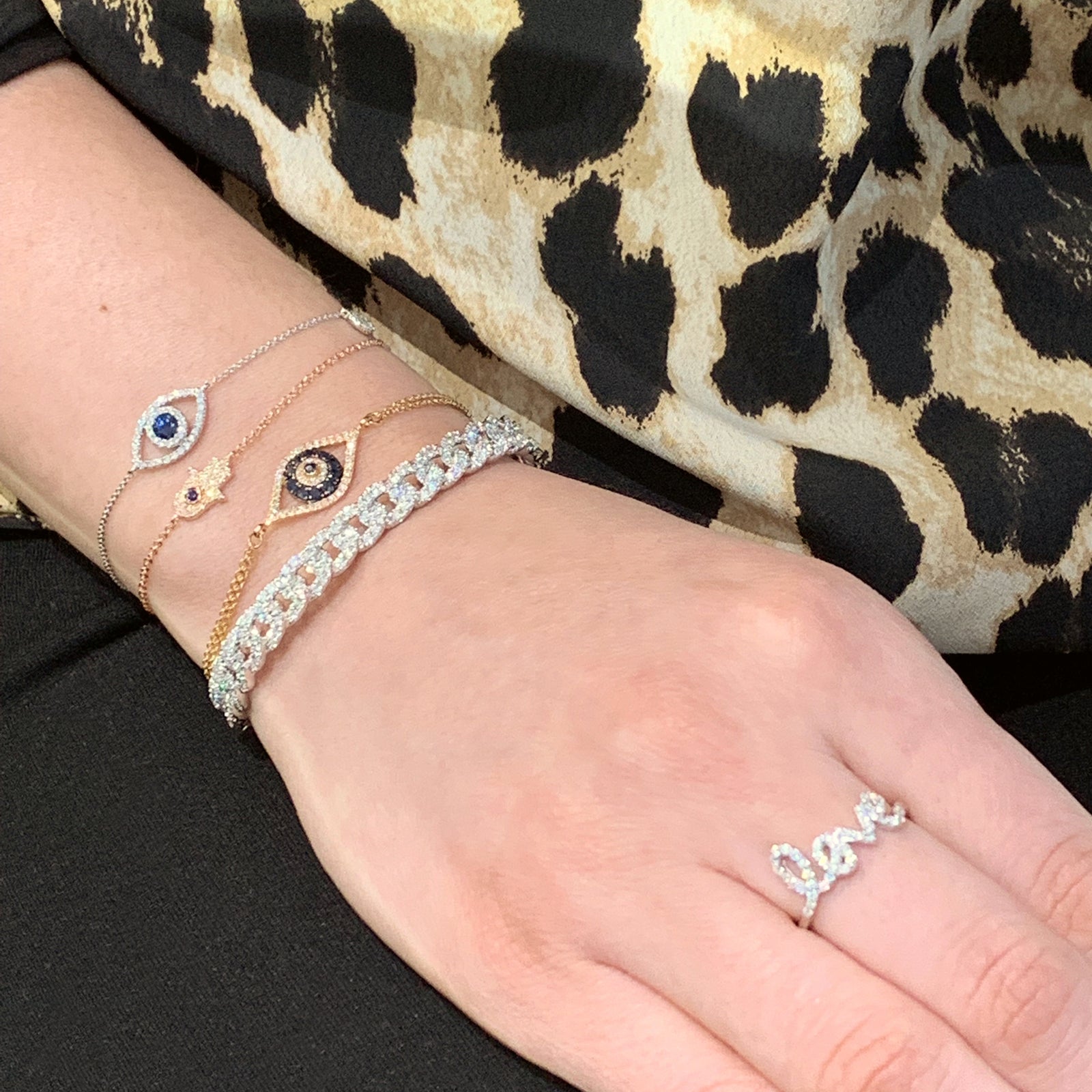 Diamond freestyle "Love" Ring  14k gold, 2.0 grams, 43 round prong set diamonds .23 carats.