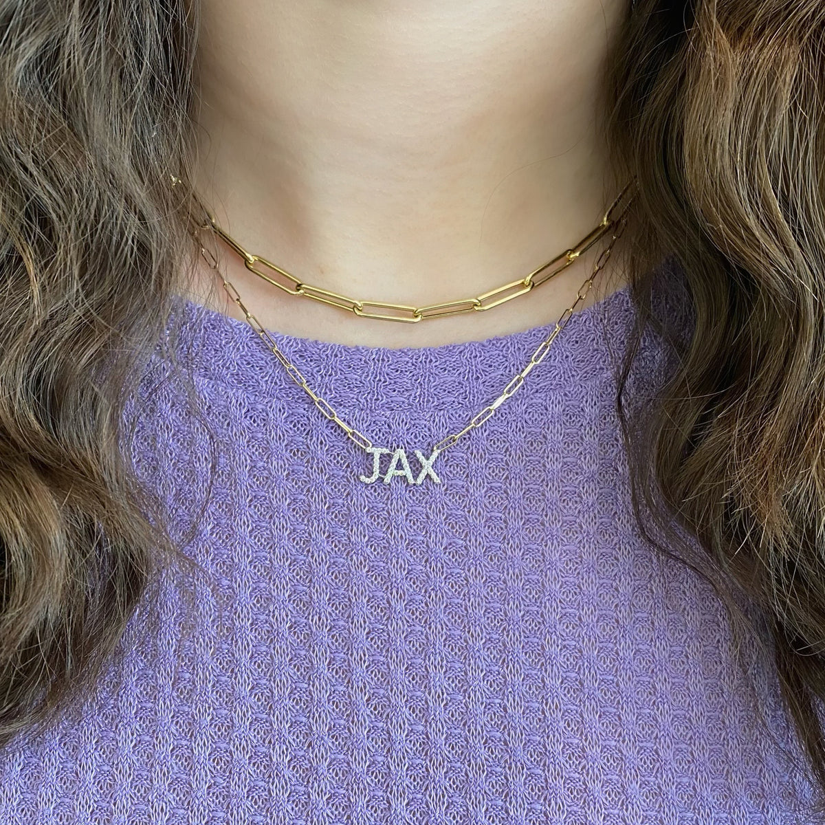 Female Model Wearing Diamond Uppercase Initial Pendant  - 14K gold weighing 1.73 grams  - 15 round diamonds totaling 0.07 carats
