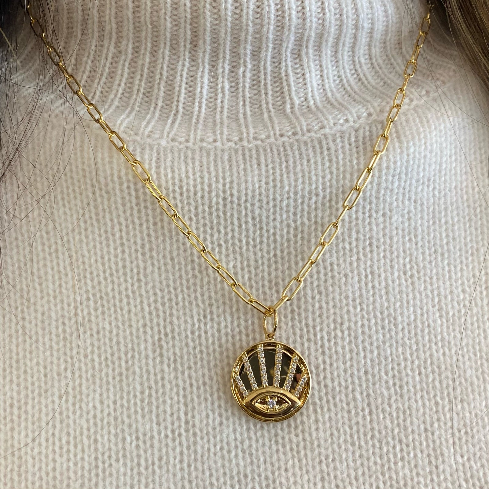 Diamond Evil Eye Disc Pendant - 14K yellow gold weighing 4.47 grams - 35 round diamonds totaling 0.24 carats