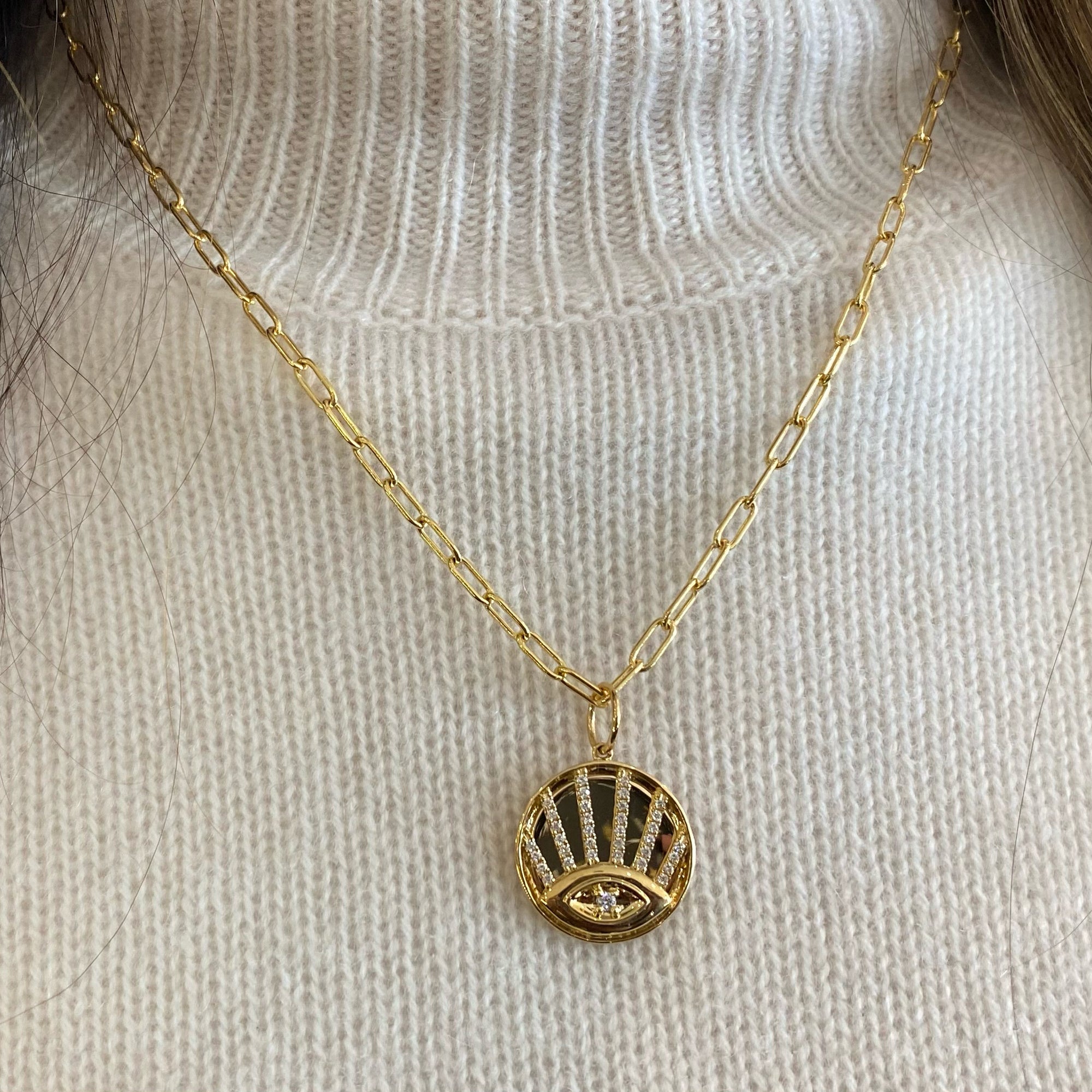 Diamond Evil Eye Disc Pendant - 14K yellow gold weighing 4.47 grams - 35 round diamonds totaling 0.24 carats