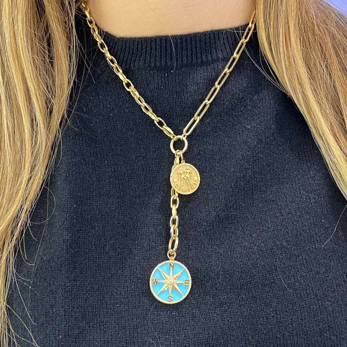 Female model wearing Diamond & Enamel Compass Pendant - 14K gold weighing 3.40 grams  - 101 round diamonds weighing 0.32 carats