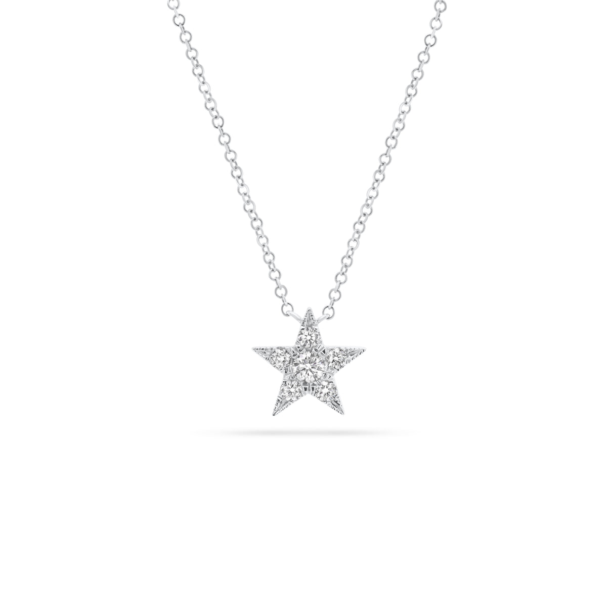 Diamond Twinkling Star Pendant  - 14K gold weighing 1.71 grams  - 6 round diamonds totaling 0.22 carats