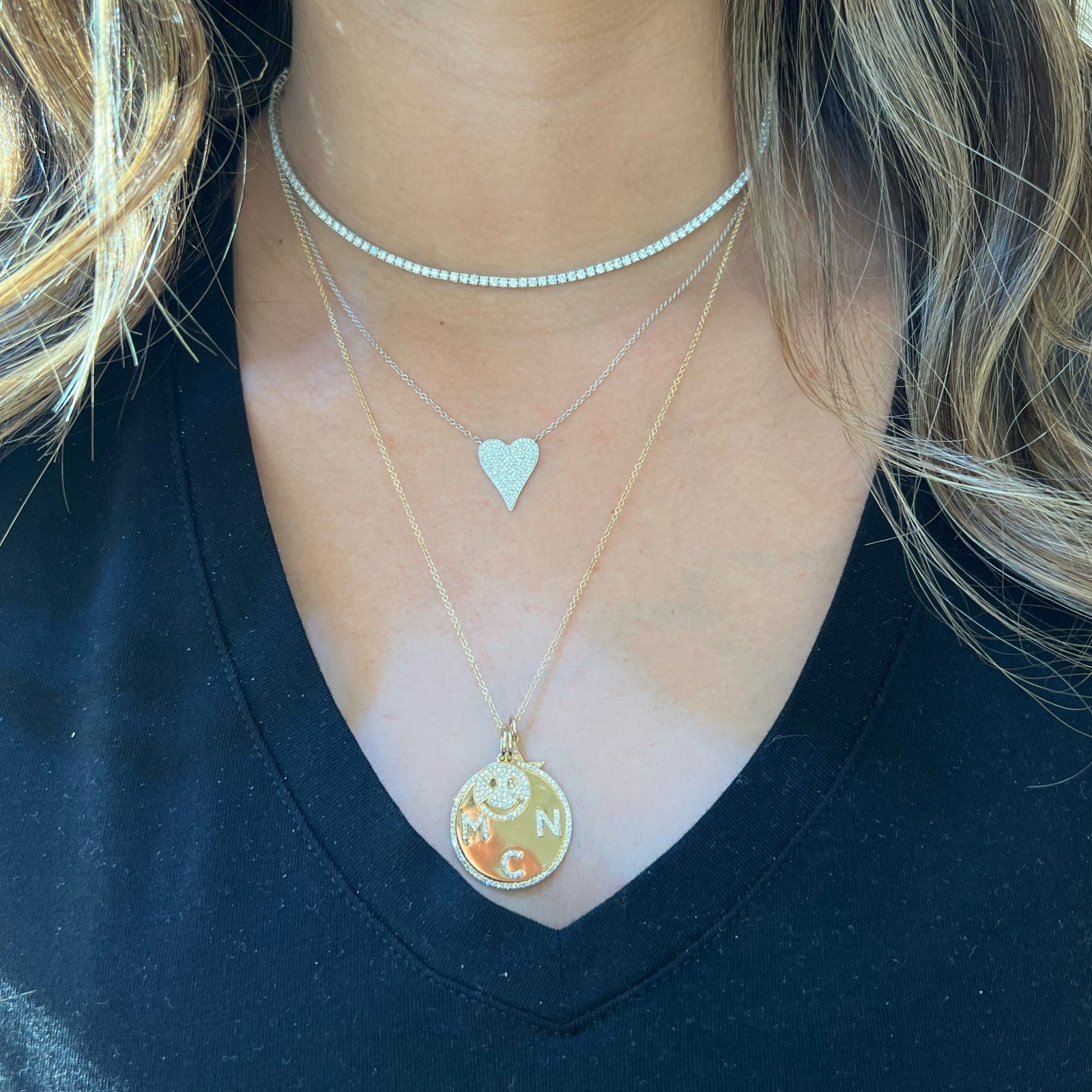 Diamond Small Elongated Heart Pendant  - 14K gold weighing 2.64 grams  - 166 round diamonds totaling 0.32 carats