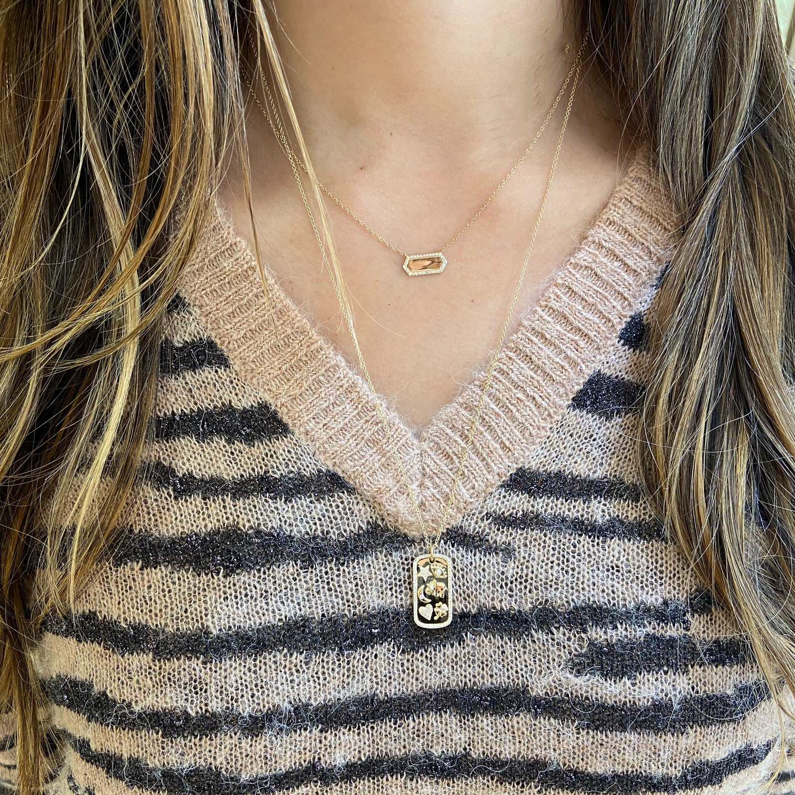 Diamond Lucky Symbols Dog Tag Pendant  - 14K gold weighing 5.18 grams  - 95 round diamonds totaling 0.21 carats