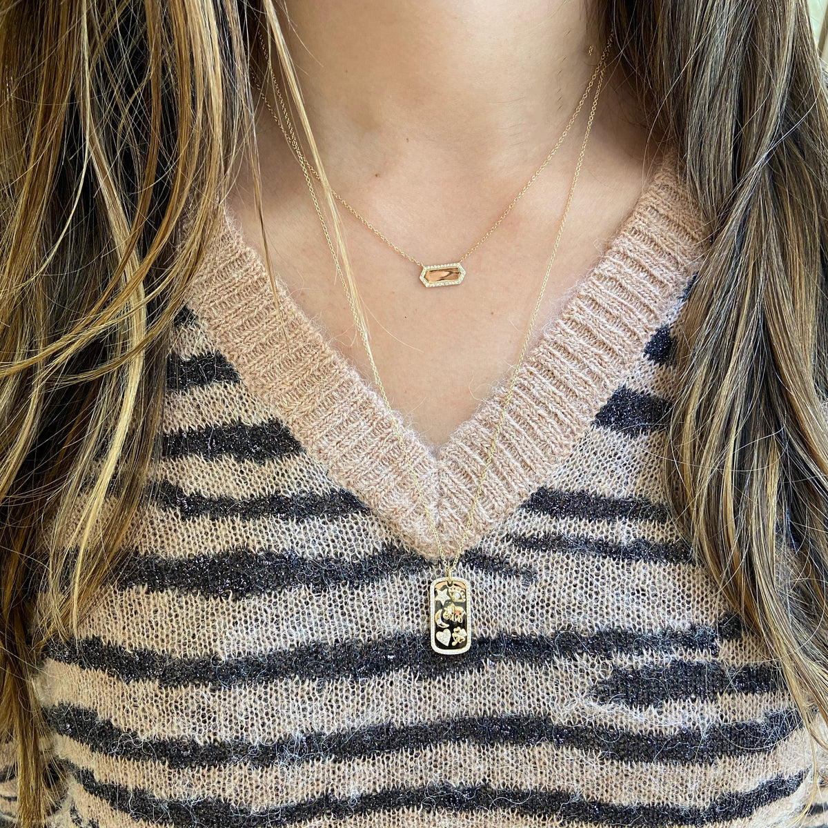 Female Model Wearing Diamond Modern Shape Pendant  - 14K gold weighing 2.20 grams  - 32 round diamonds totaling 0.09 carats