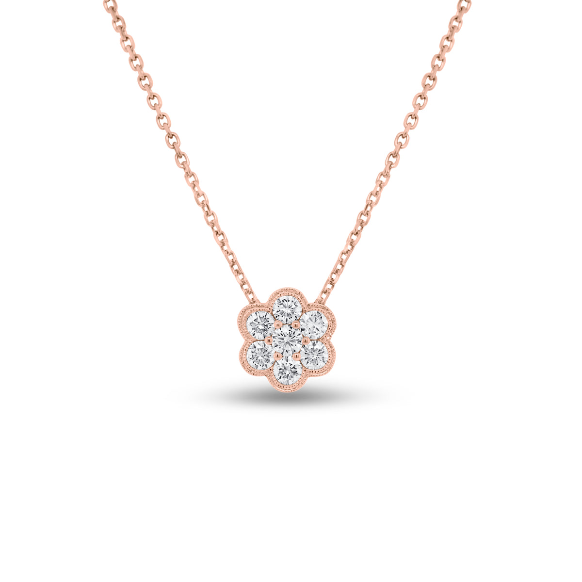 Diamond Flower Cluster Pendant  - 18K gold weighing 1.34 grams  - 14K gold weighing 1.90 grams  - 7 round diamonds totaling 0.63 carats