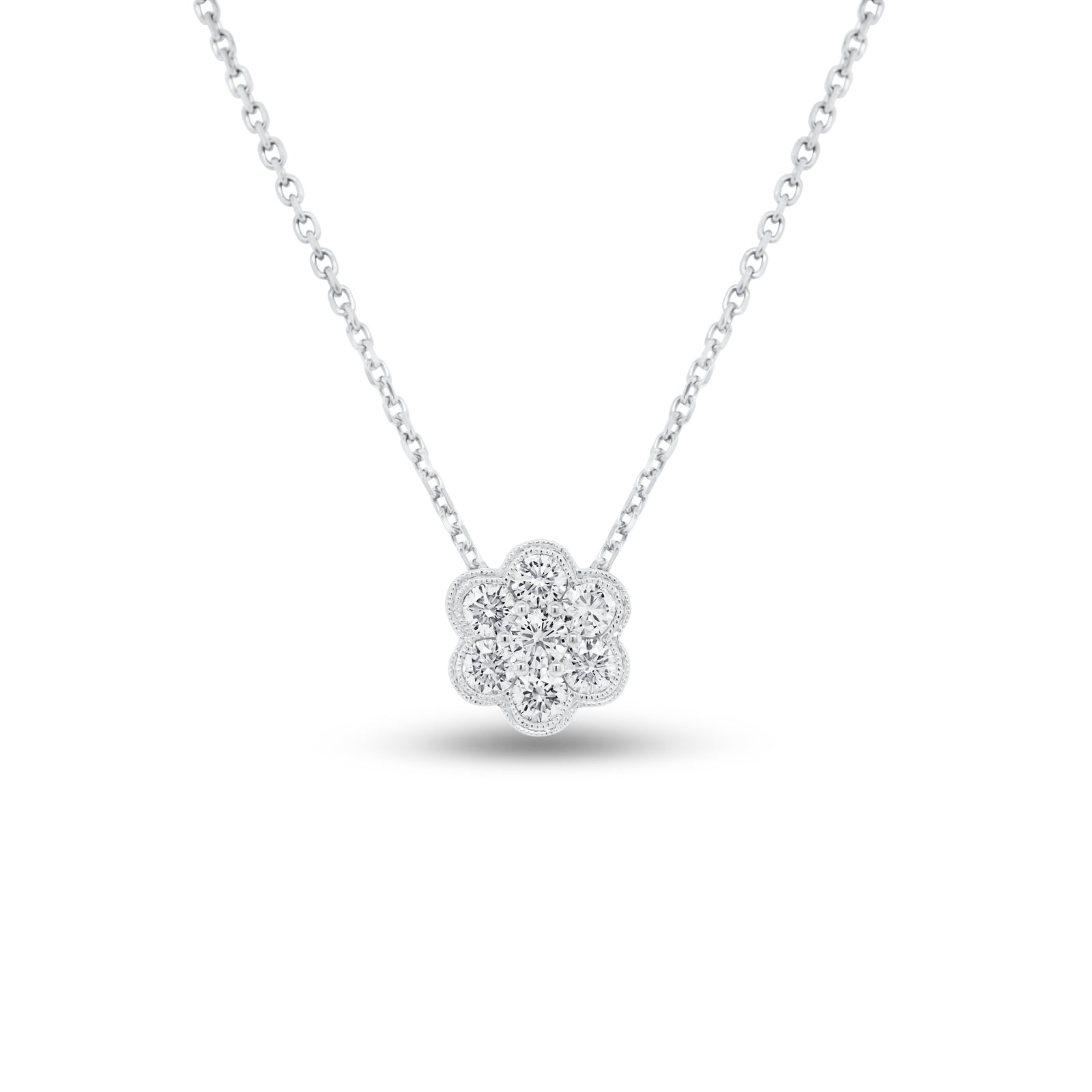 Diamond Flower Cluster Pendant  - 18K gold weighing 1.34 grams  - 14K gold weighing 1.90 grams  - 7 round diamonds totaling 0.63 carats