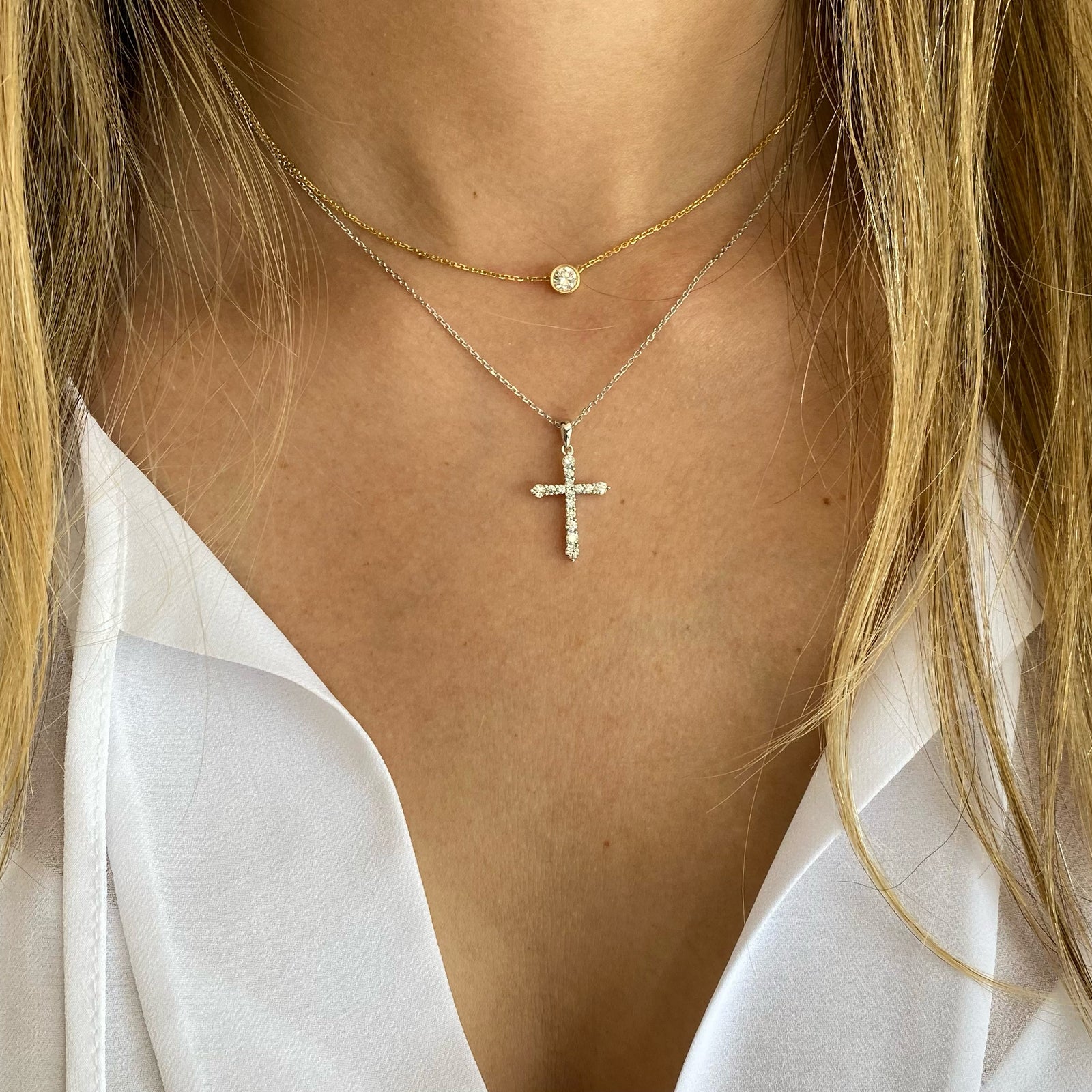 Diamond Classic Cross Pendant  - 14K gold weighing 2.57 grams  - 15 round diamonds totaling 0.45 carats