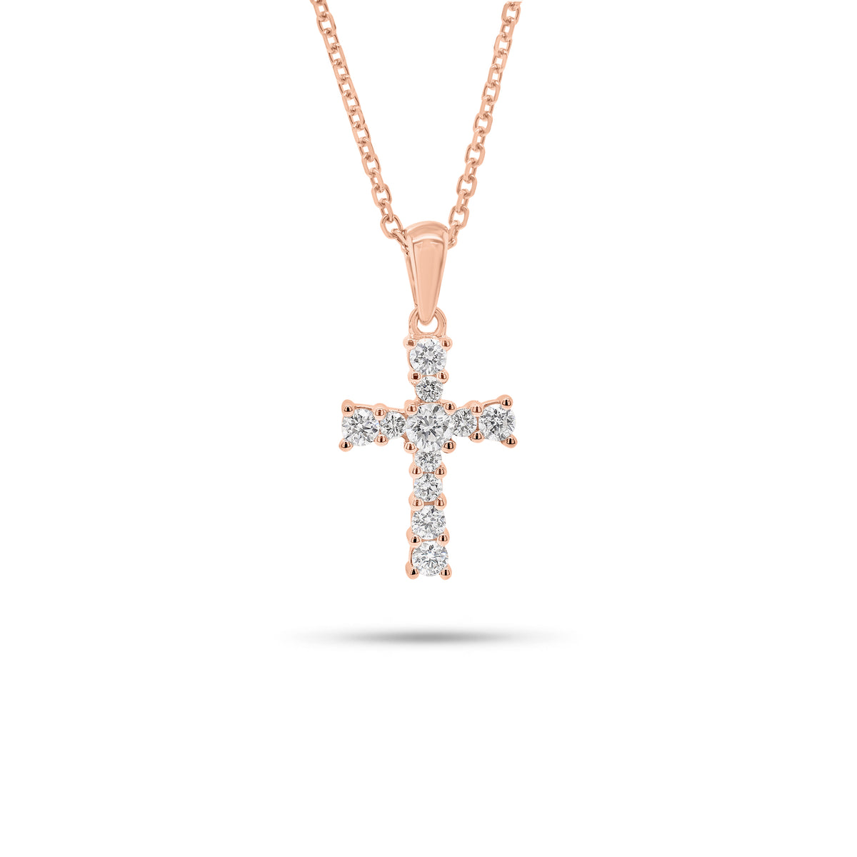Graduated Diamond Cross Pendant - 18K gold weighing 0.91 grams  - 14K gold weighing 1.60 grams  - 11 round diamonds weighing 0.28 carats