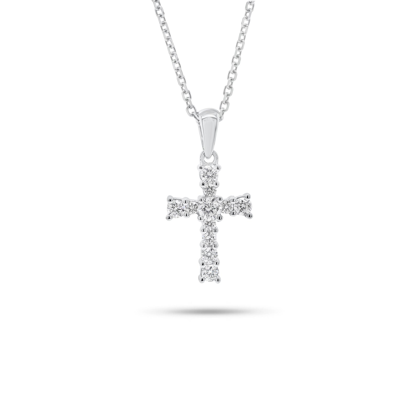 Graduated Diamond Cross Pendant - 18K gold weighing 0.91 grams  - 14K gold weighing 1.60 grams  - 11 round diamonds weighing 0.28 carats