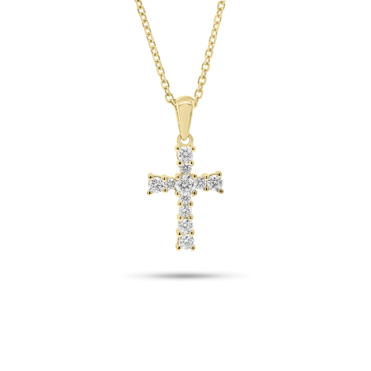 Graduated Diamond Cross Pendant - 18K gold weighing 0.91 grams  - 14K gold weighing 1.60 grams  - 11 round diamonds weighing 0.28 carats