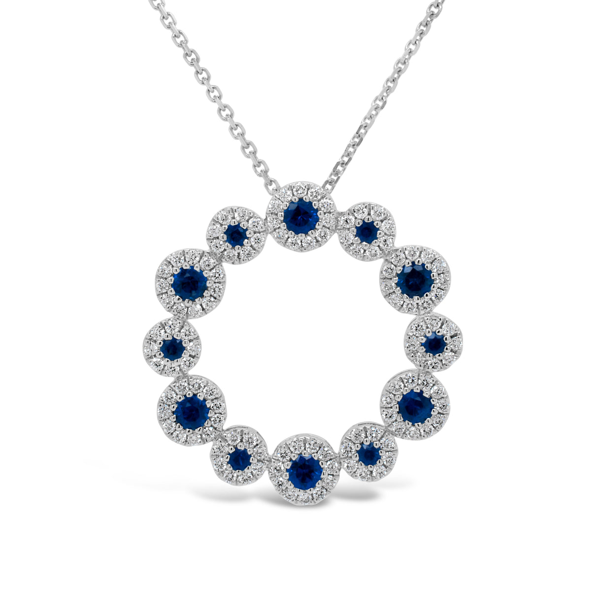 Sapphire & Diamond Wreath Pendant  - 18K gold weighing 3.21 grams  - 14K gold weighing 1.60 grams  - 114 round diamonds totaling 0.52 carats  - 12 sapphires totaling 0.77 carats