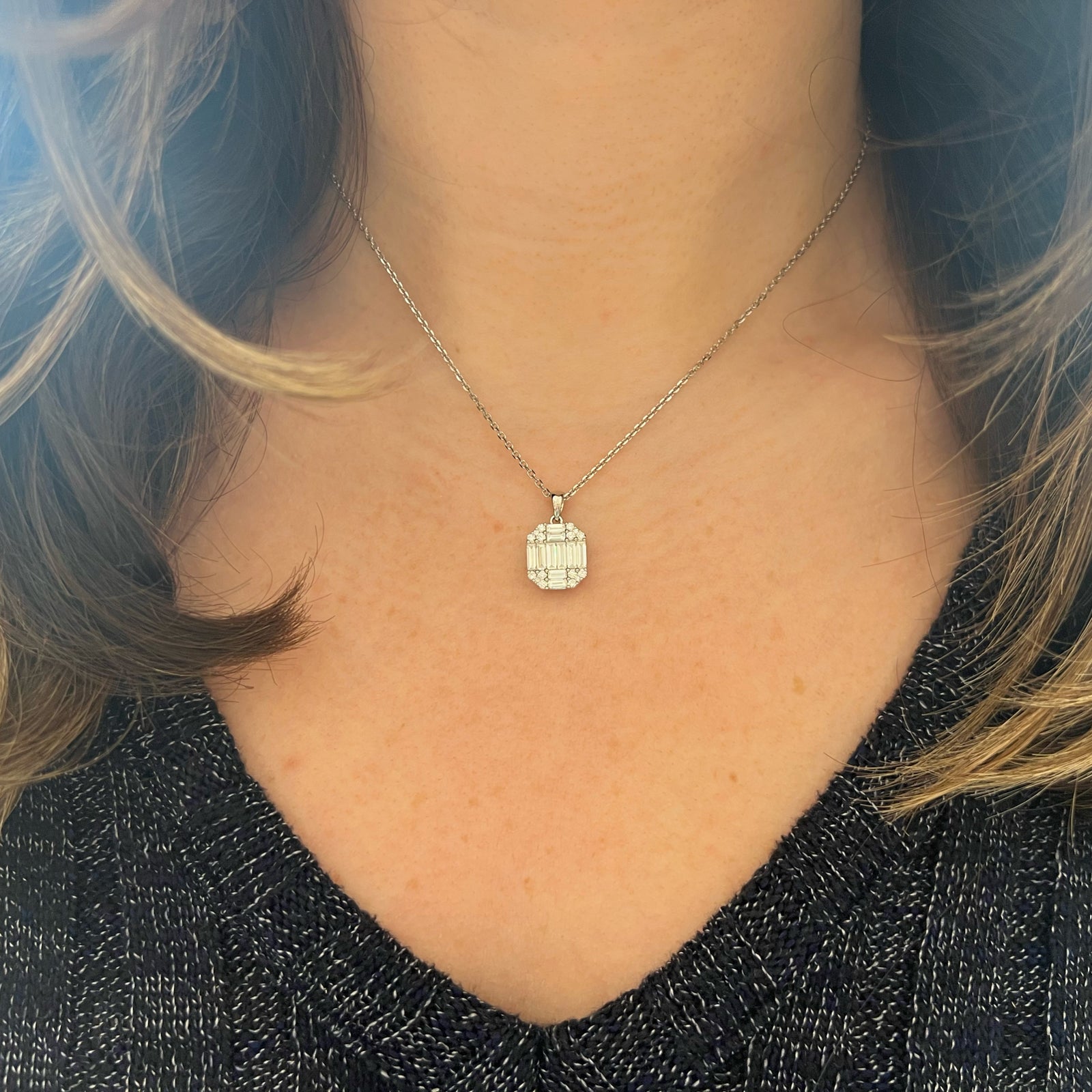 Baguette and round diamond octagon pendant - 14K gold weighing 4.0 grams  - 16 round diamonds weighing 0.21 carats  - 10 slim baguettes weighing 0.84 carats