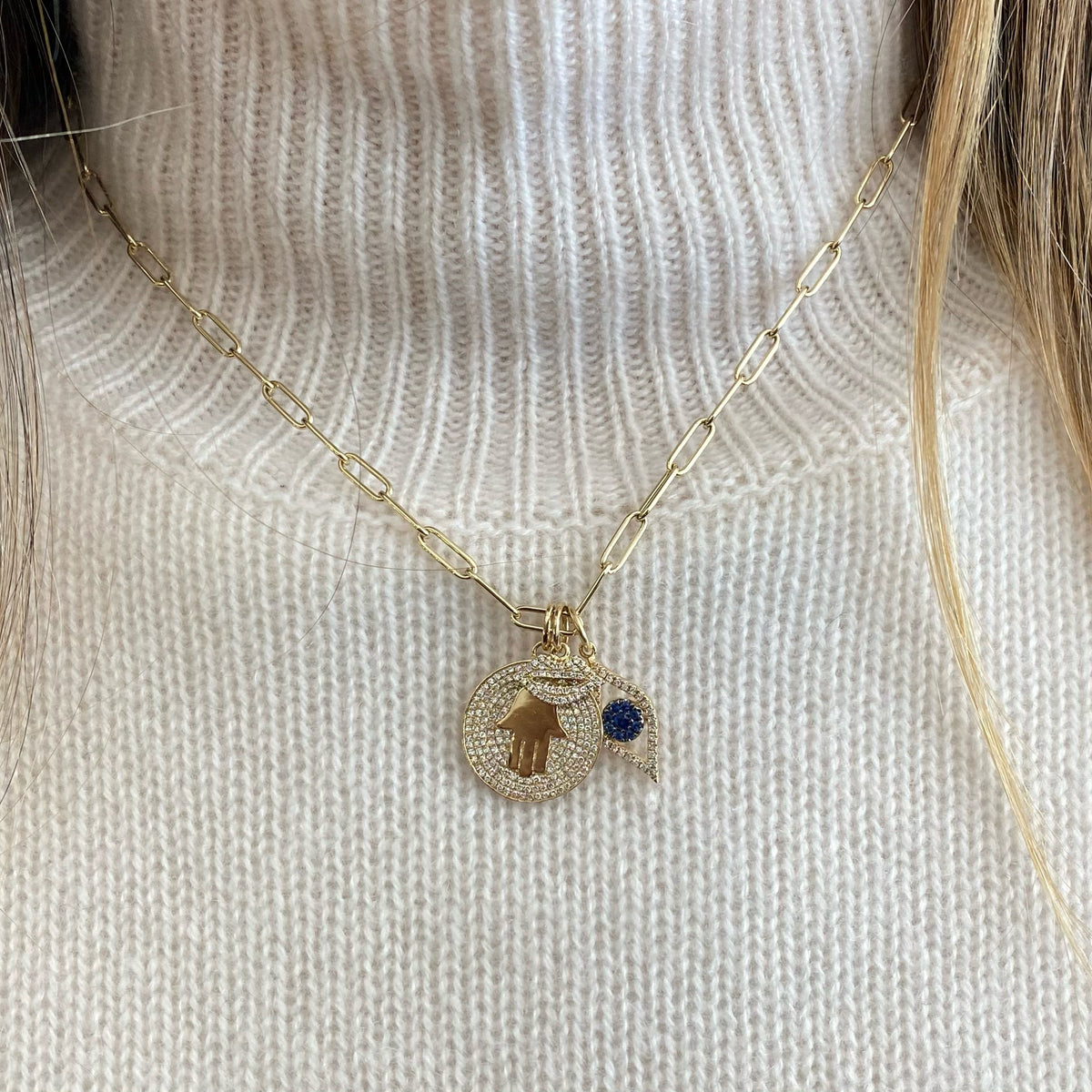 Female Model Wearing Diamond Hamsa Disc Pendant  - 14K gold weighing 3.14 grams  - 178 round diamonds totaling 0.41 carats