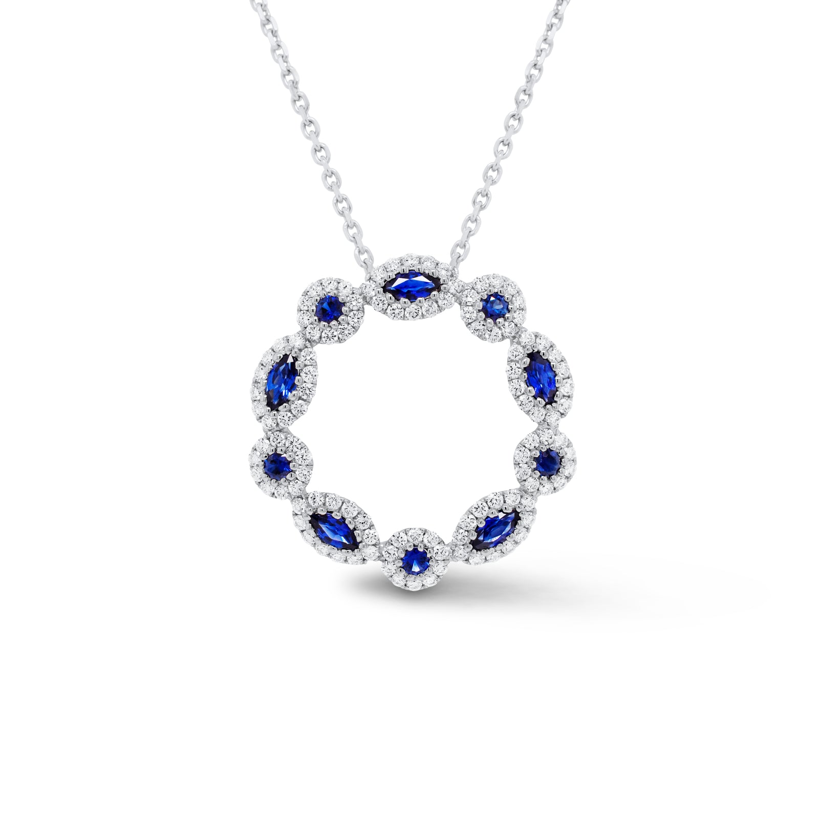 Sapphire & Diamond Wreath Pendant  - 18K gold weighing 3.13 grams  - 14K gold weighing 2.20 grams  - 110 round diamonds totaling 0.66 carats  - 10 sapphires totaling 0.64 carats