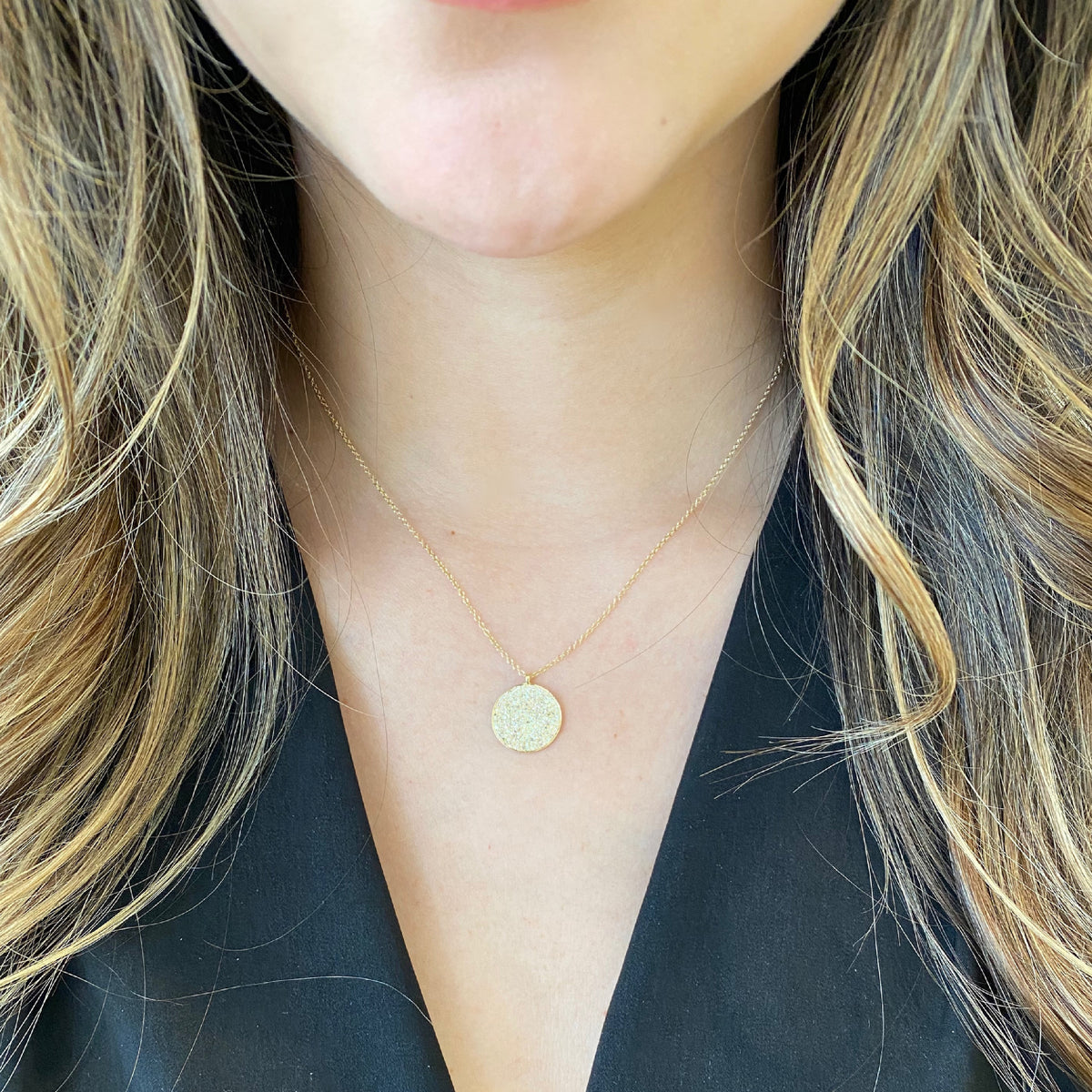 Female Model Wearing Large Diamond Disc Pendant  - 14K gold weighing 2.60 grams.  - 174 round diamonds totaling 0.55 carats.