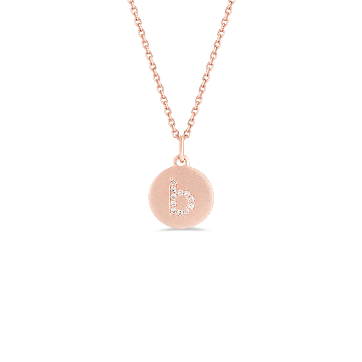 Mini Diamond Initial Disc Pendant  -14k gold weighing 2.30 grams  -Round diamonds prong set diamonds  -Disc measures diameter 10 millimeters.