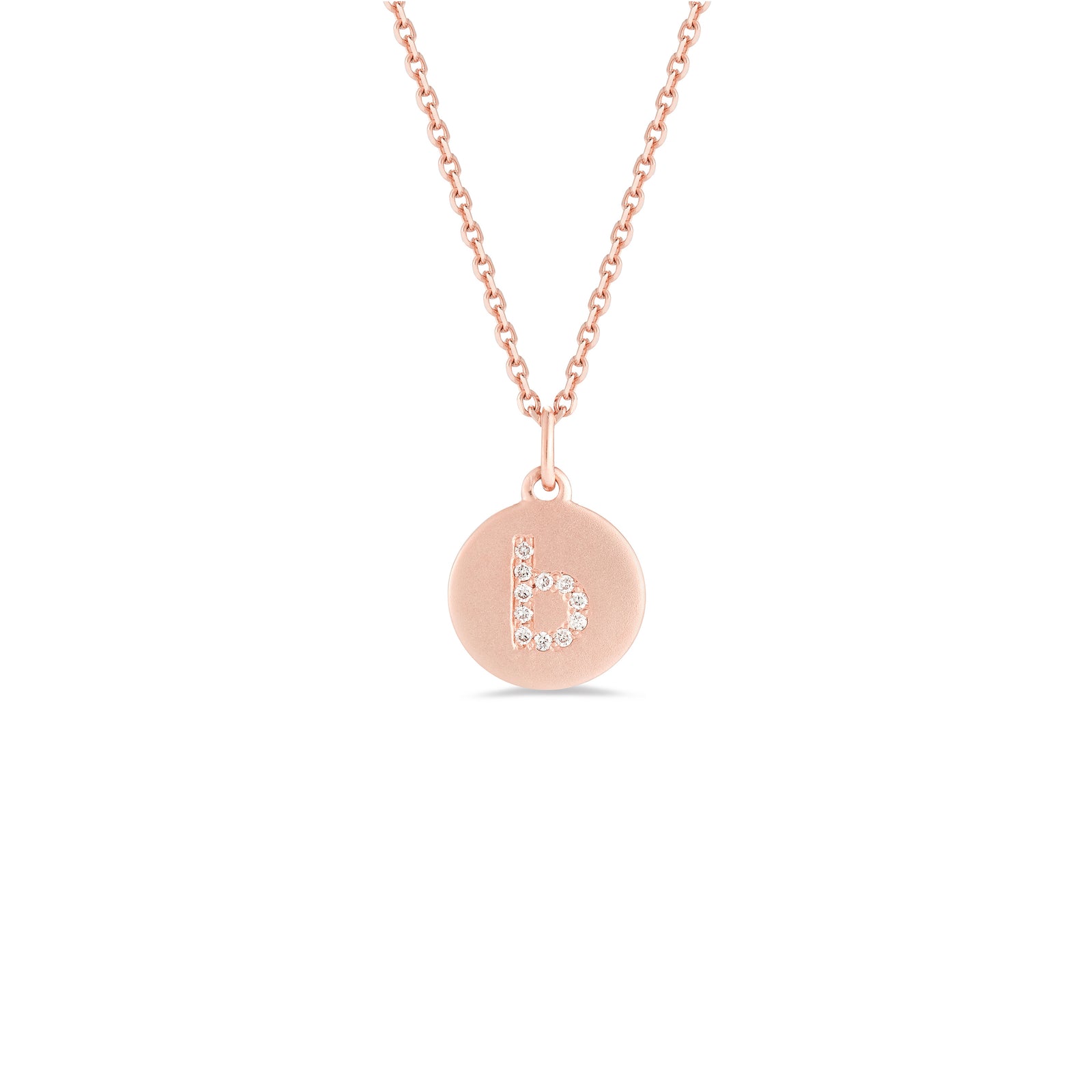 Mini Diamond Initial Disc Pendant  -14k gold weighing 2.30 grams  -Round diamonds prong set diamonds  -Disc measures diameter 10 millimeters.