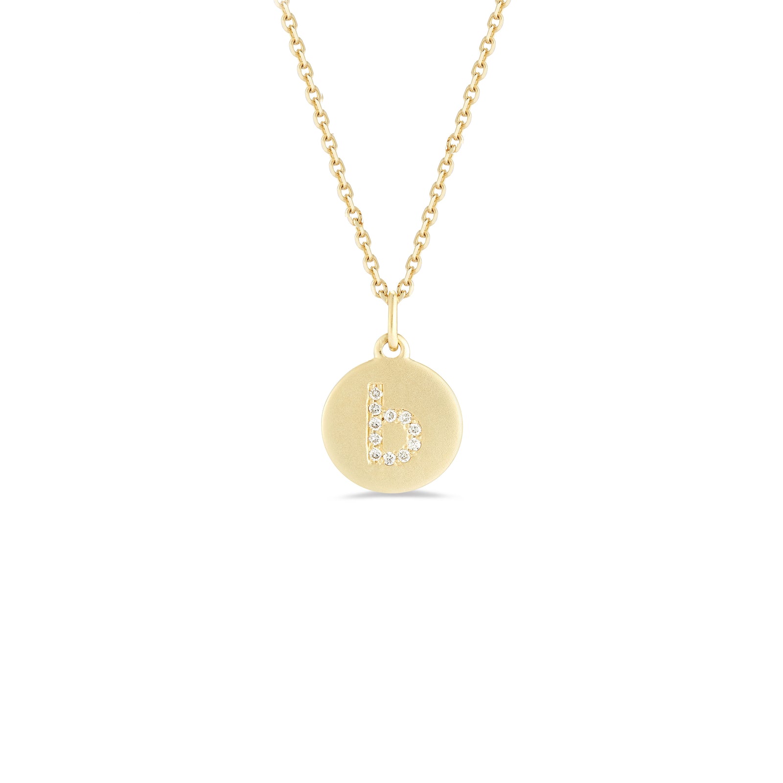 Mini Diamond Initial Disc Pendant  -14k gold weighing 2.30 grams  -Round diamonds prong set diamonds  -Disc measures diameter 10 millimeters.