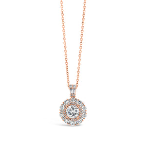 Diamond Halo Pendant with Rounds and Baguettes   - 0.70 ct diamond (GIA-Standards H color, SI2 clarity)  - 0.66 ct (total weight of round-cut diamonds)   - 0.19 ct (total weight of diamond baguettes 