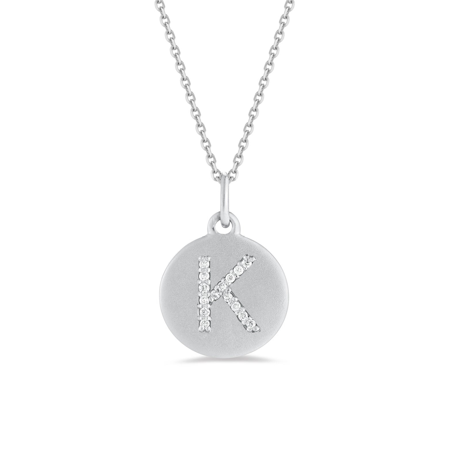 Diamond initial disc pendant - 14k gold weighing 4.0 grams  - 15 Round prong set diamonds totaling 0.08 carats.  Disc measures 15 millimeters diameter.