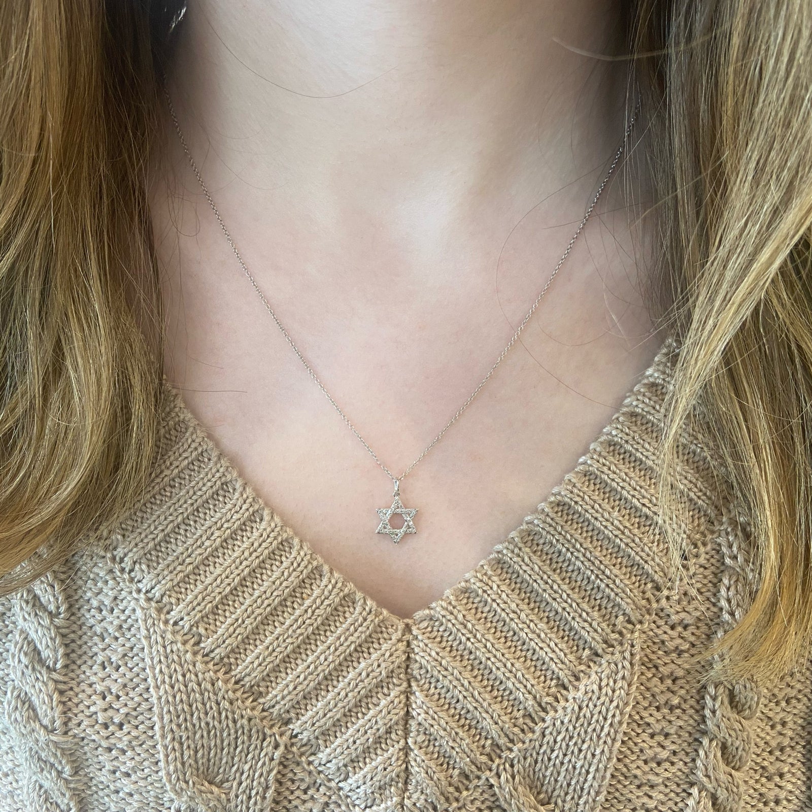 Diamond Small Star of David Pendant  - 14K gold weighing 1.52 grams  - 36 round pave-set diamonds totaling 0.11 carats