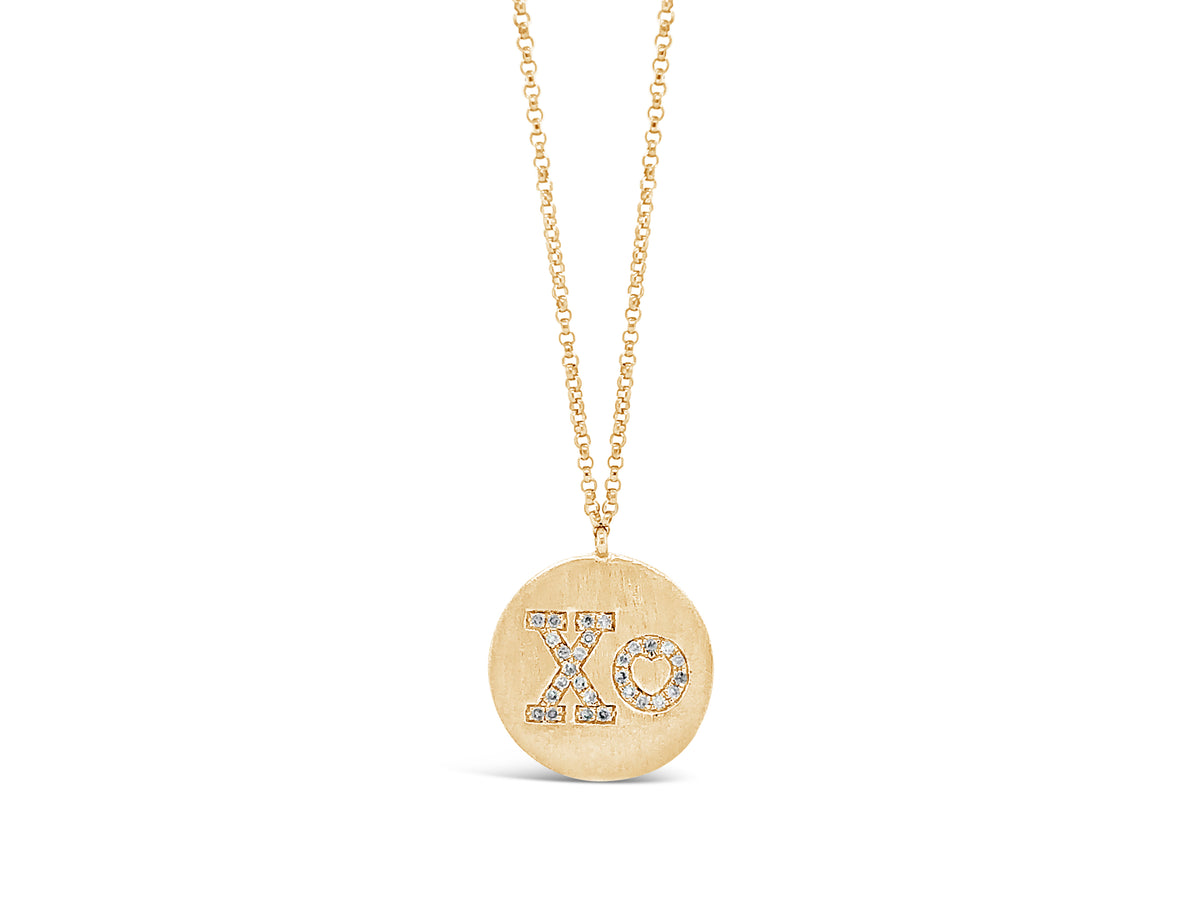 Diamond "XO" Disc Pendant Necklace -14K yellow gold weighing 3.43 grams -28 round diamonds totaling .09 carats