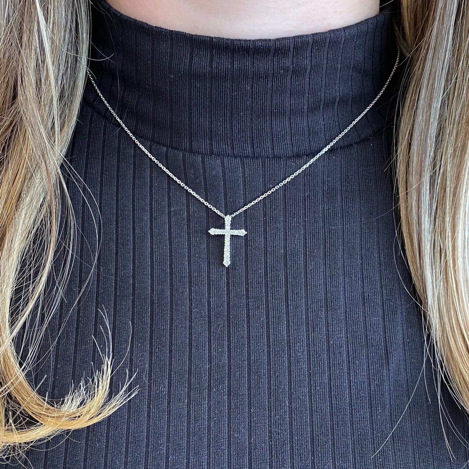 Diamond Classic Cross Pendant Necklace  -14K gold weighing 2.40 grams  -15 round prong-set brilliant diamonds totaling 0.44 carats