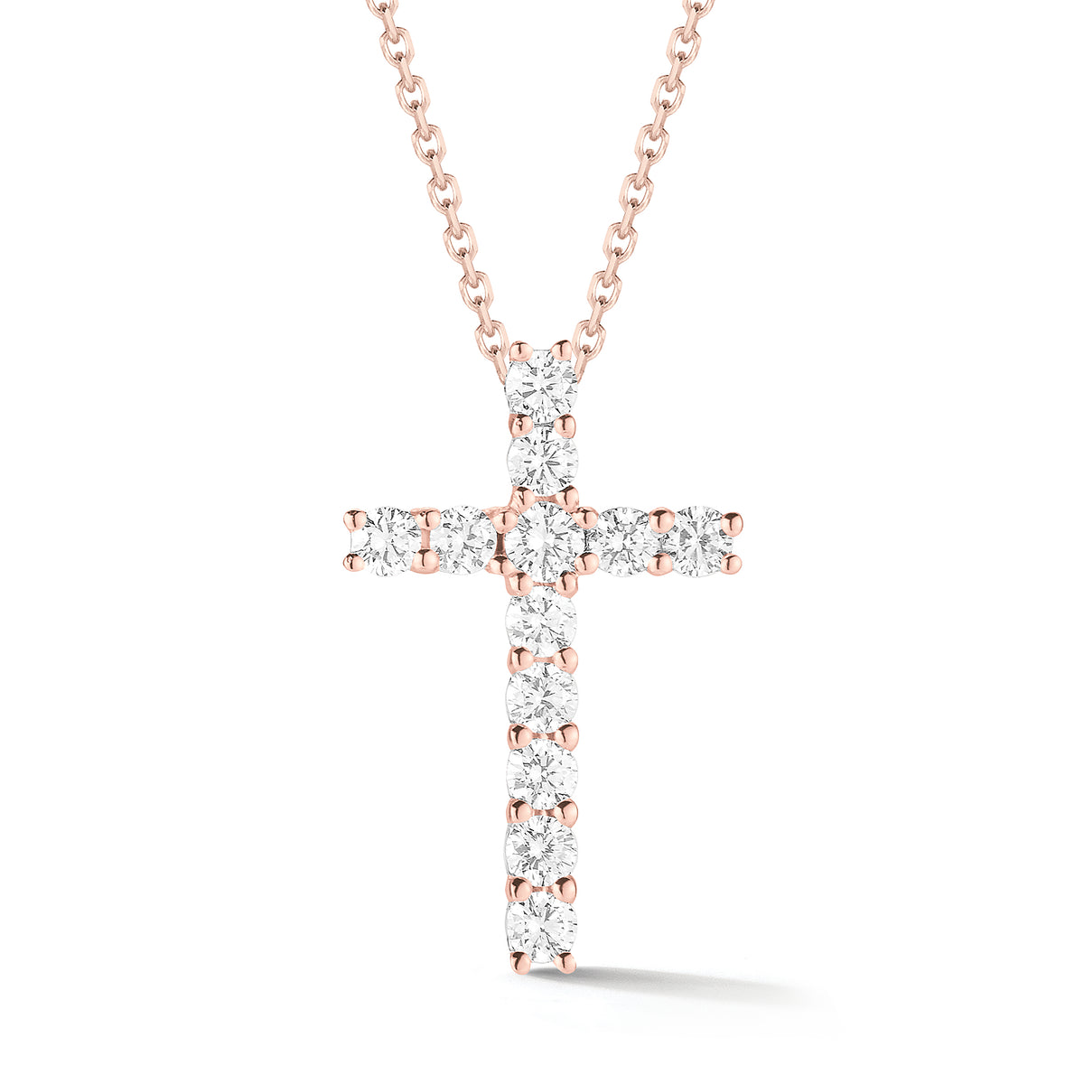 Diamond Simple Cross Pendant  -14K gold weighing 2.6 grams  -12 round shared prong-set brilliant-cut diamonds totaling 0.44 carats.