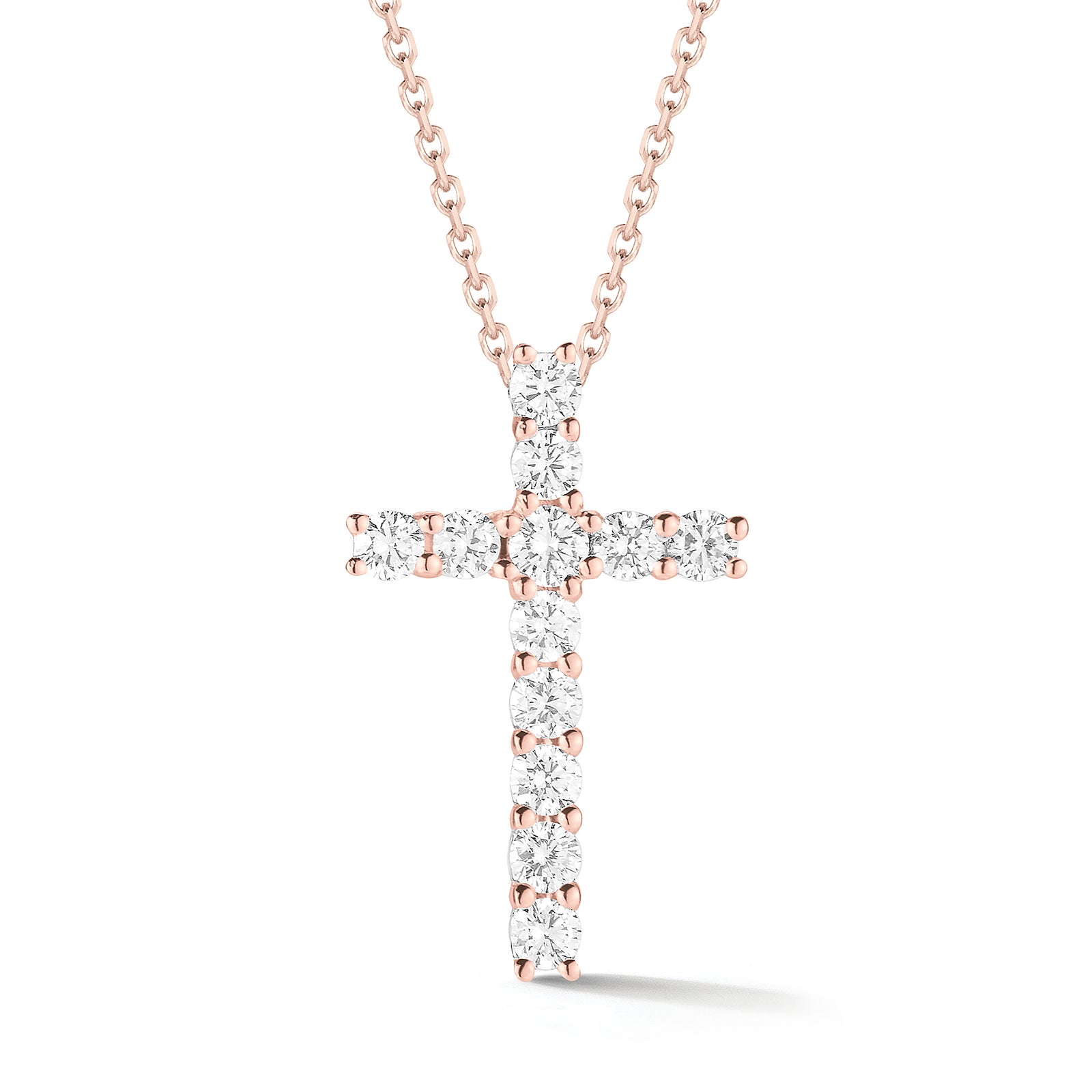 Diamond Simple Cross Pendant  -14K gold weighing 2.6 grams  -12 round shared prong-set brilliant-cut diamonds totaling 0.44 carats.