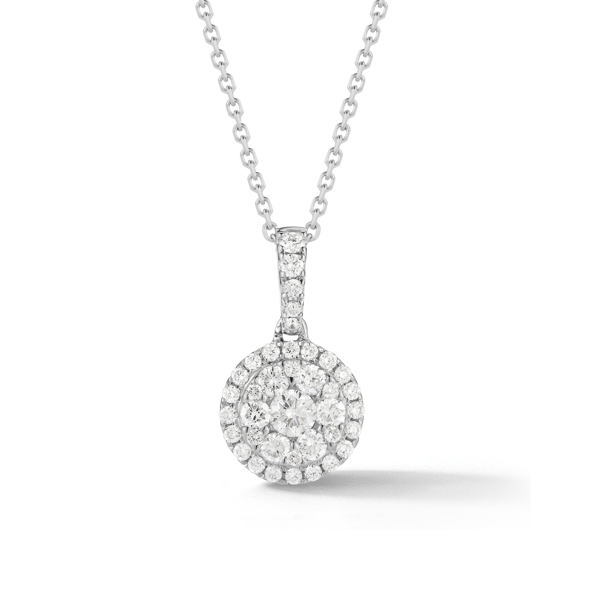 Small Diamond Halo Pendant Necklace  -18K gold weighing 1.09 grams  -38 round pave-set diamonds totaling 0.48 carats  -14K gold chain weighing 1.60 grams
