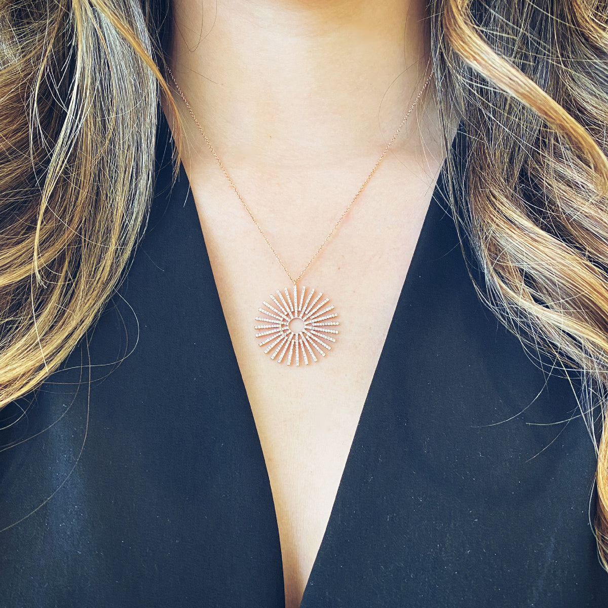 Female Model Wearing Diamond Full Sunburst Pendant Necklace  -14K gold weighing 5.01 grams  -322 round pave- set diamonds totaling 0.87 carats.