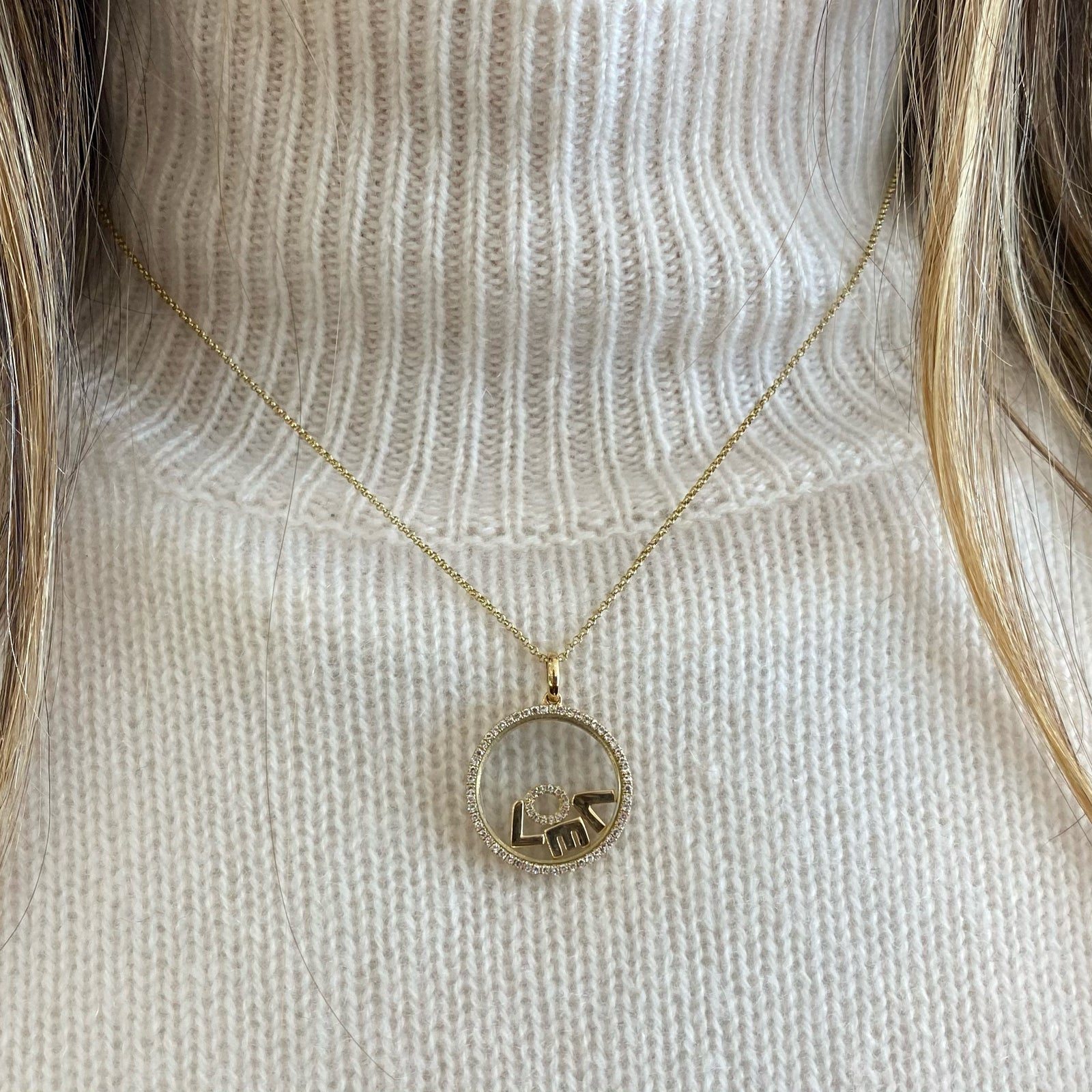 Diamond "Love" Pendant Necklace -14K yellow gold weighing 5.23 grams -68 round diamonds totaling 0.25 carats