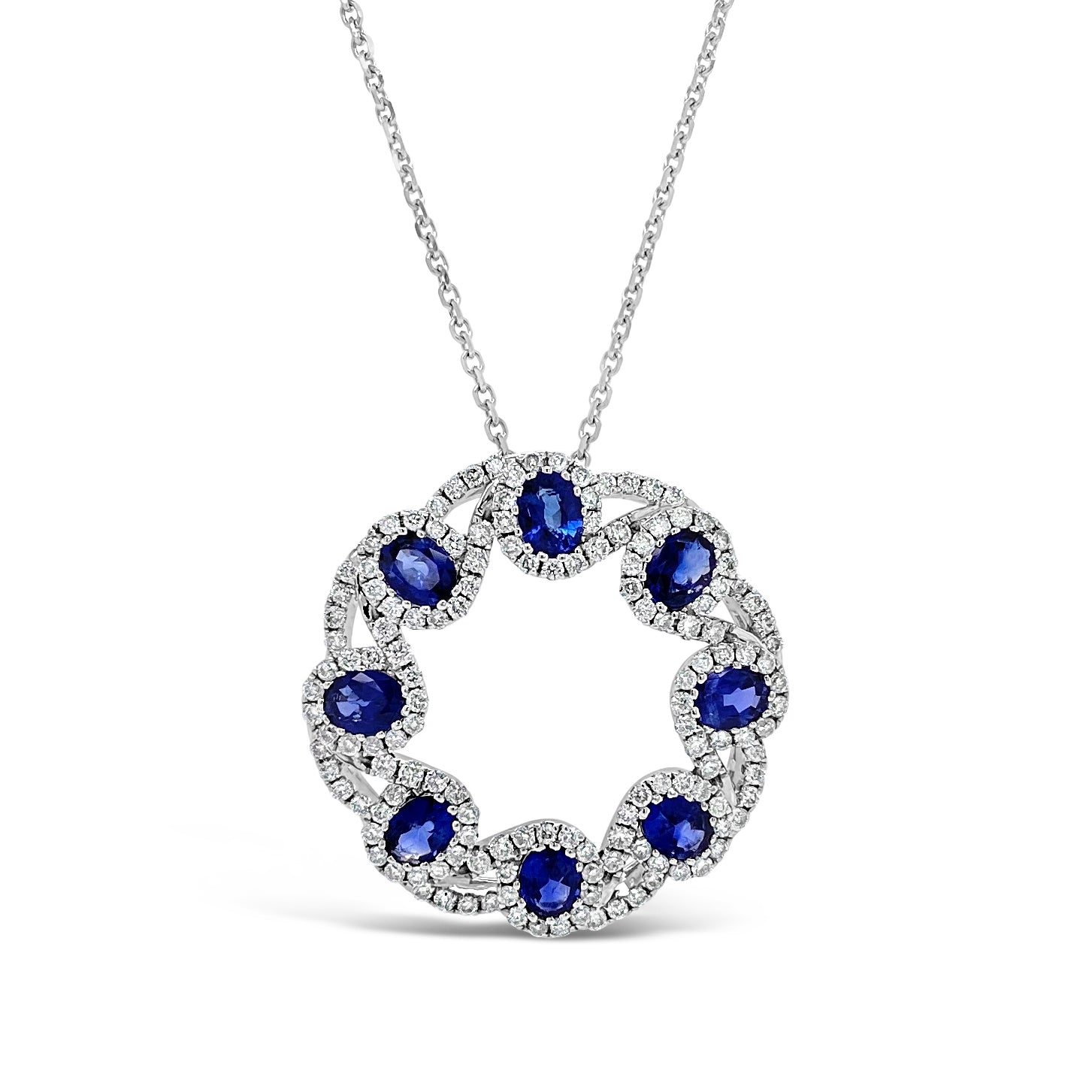 Sapphire & Diamond Woven Circle Pendant  - 14K gold weighing 5.82 grams  - 8 oval-shaped sapphires totaling 1.62 carats  - 144 round diamonds totaling 0.80 carats