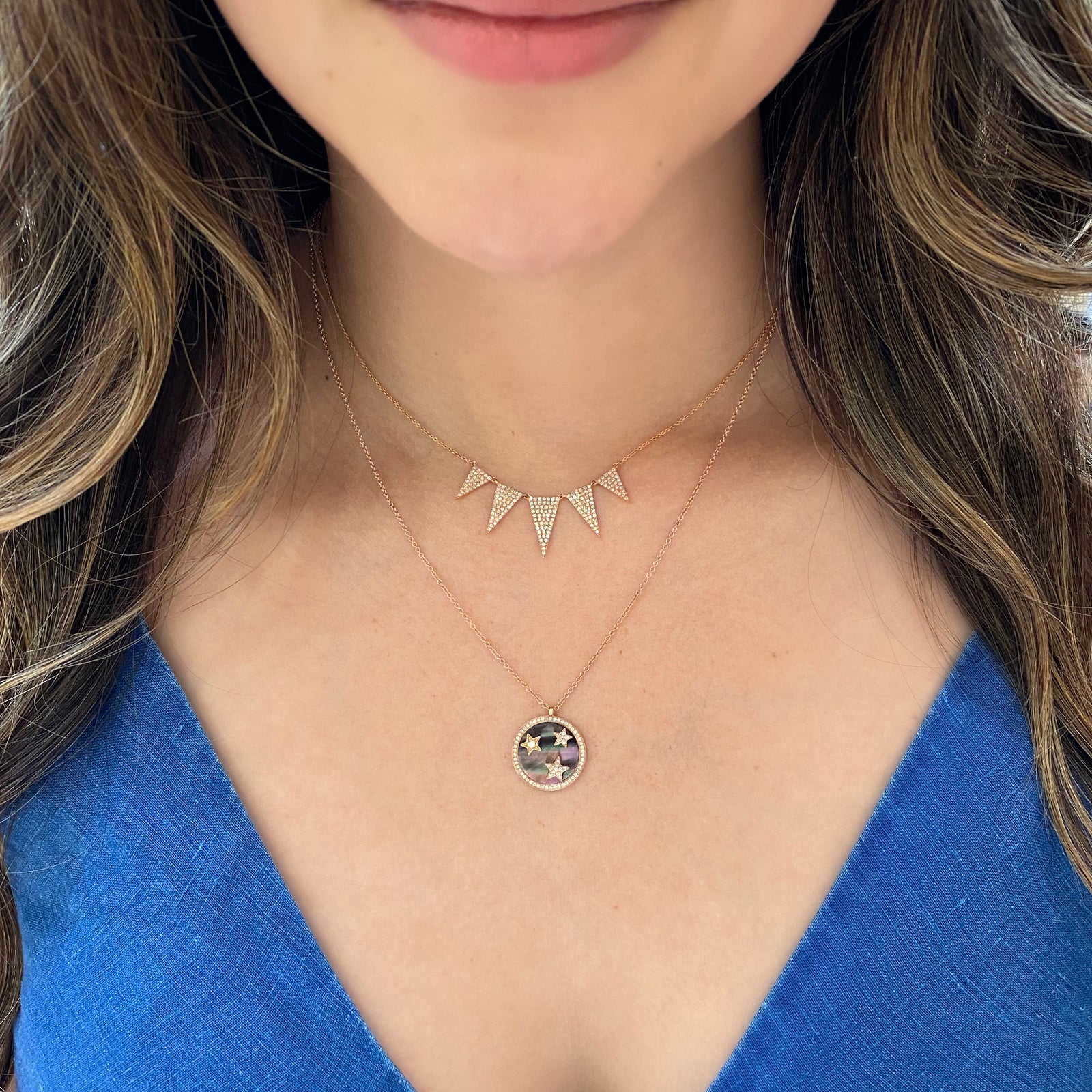 Grey Mother of Pearl Pendant with Diamond Stars  -14K gold weighing 3.40 grams  - 70 round diamonds totaling 0.18 carats  - 1 mother of pearl