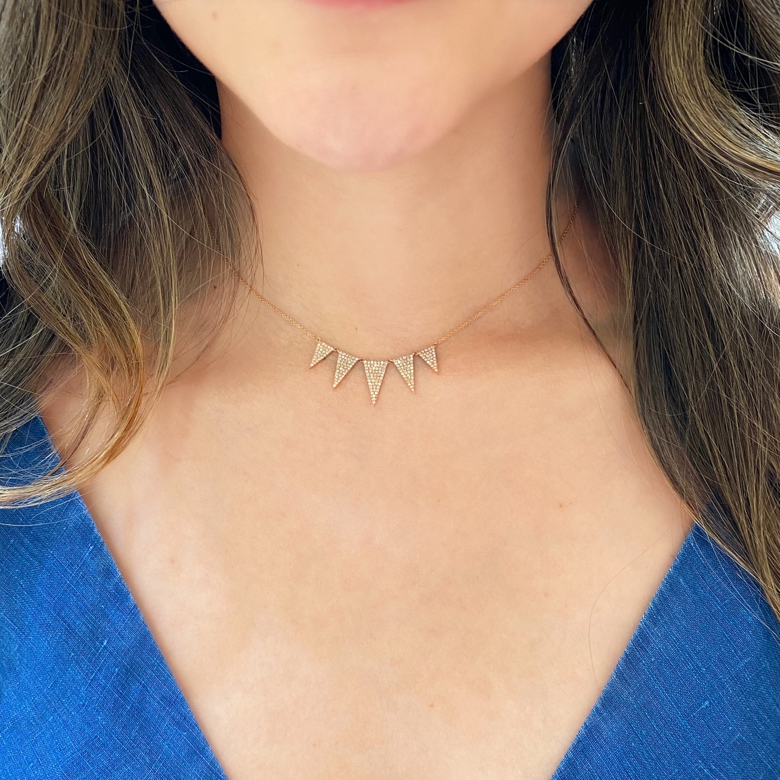 Diamond Graduated Triangle Necklace  -14K gold weighing 3.07 grams  -193 round pave-set diamonds totaling 0.57 carats.