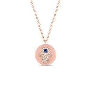 Diamond & Sapphire Hamsa Disc Pendant Necklace -14K rose gold weighing 3.2 grams -Round pave set diamonds totaling .08 carats -0.04 ct sapphire