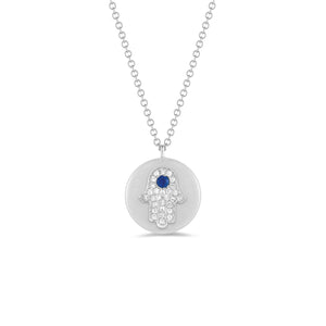 Diamond & Sapphire Hamsa Disc Pendant Necklace -14K white gold weighing 3.2 grams -Round pave set diamonds totaling .08 carats -0.04 ct sapphire