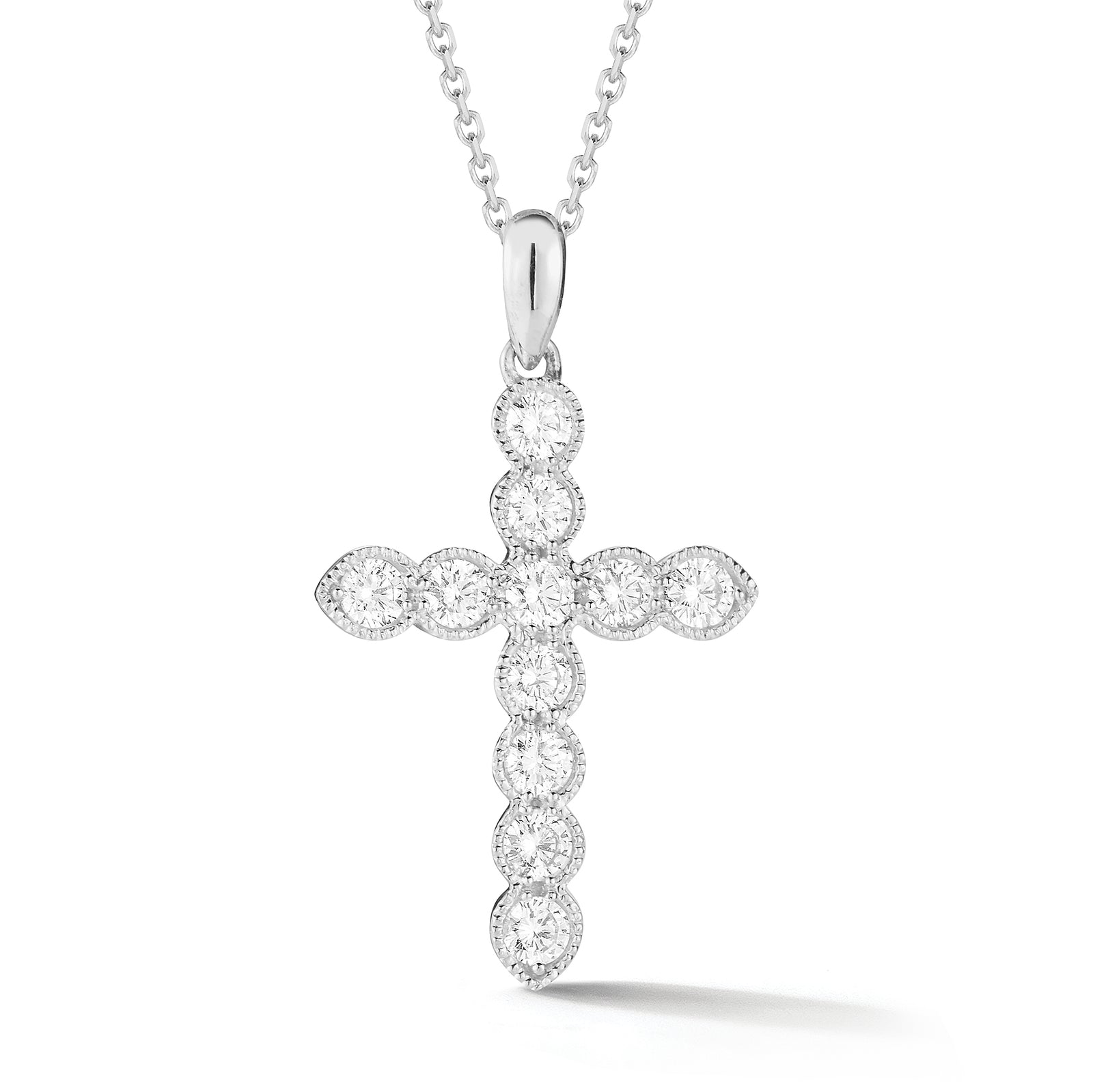 Bezel-Set Diamond Cross Pendant with Antique Milgrain  The perfect gift for a christening, communion, confirmation, birthday, or holiday.  -14K gold weighing 3.80 grams  -11 round bezel-set brilliant diamonds k 0.62 carats