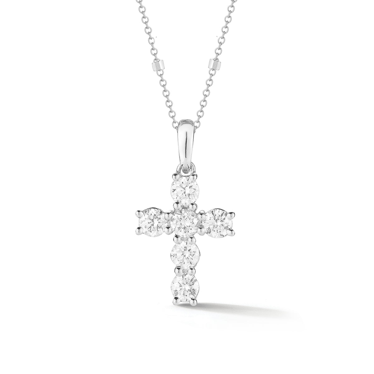 Mini Diamond Cross Pendant with Gold Accented Chain  -18K gold weighing 1.58 grams  -6 round shared prong-set brilliant diamonds totaling 0.87 carats