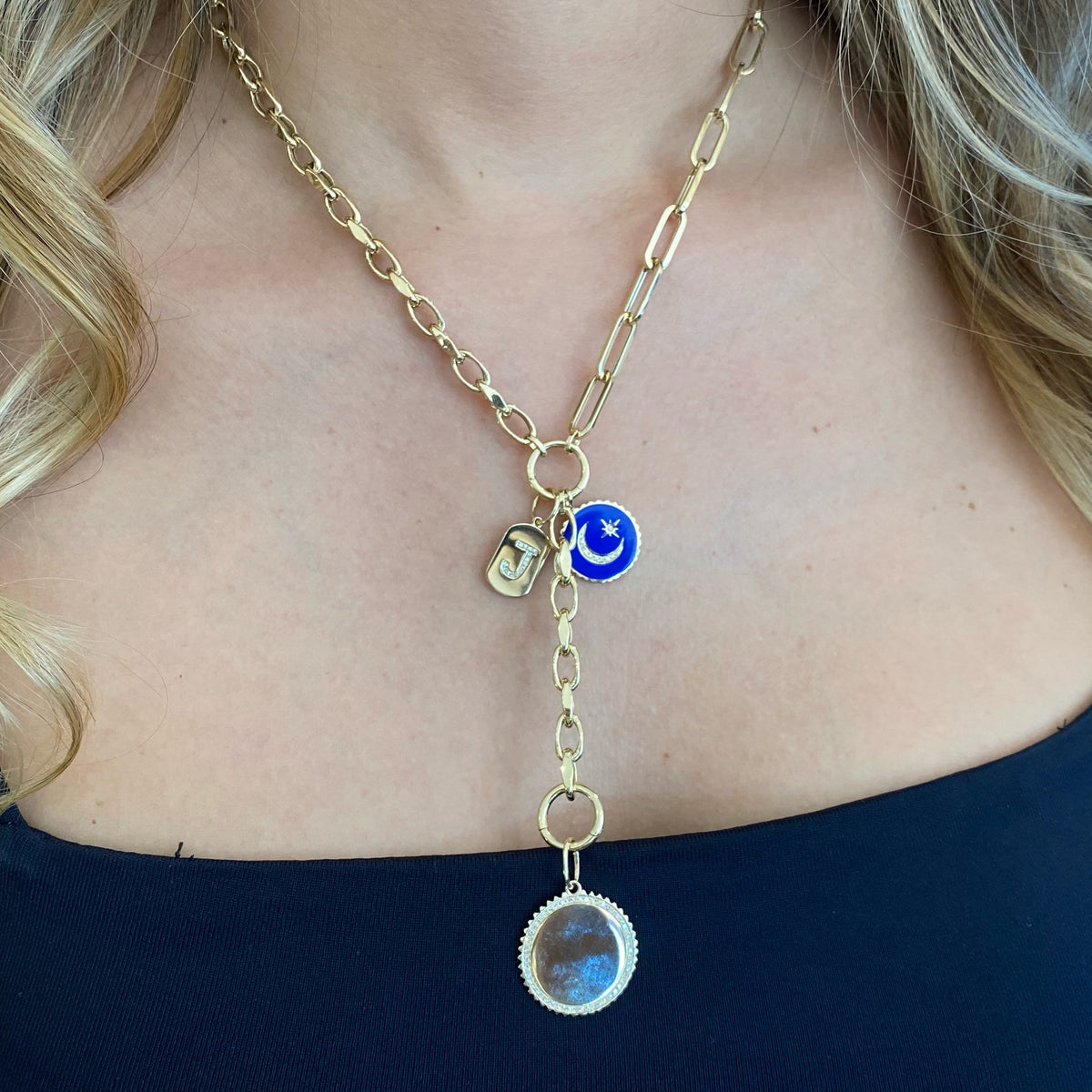 Female model wearing Diamond & Gold Disc Pendant with Grooved Frame - 14K yellow gold weighing 4.49 grams - 54 round diamonds totaling 0.20 carats