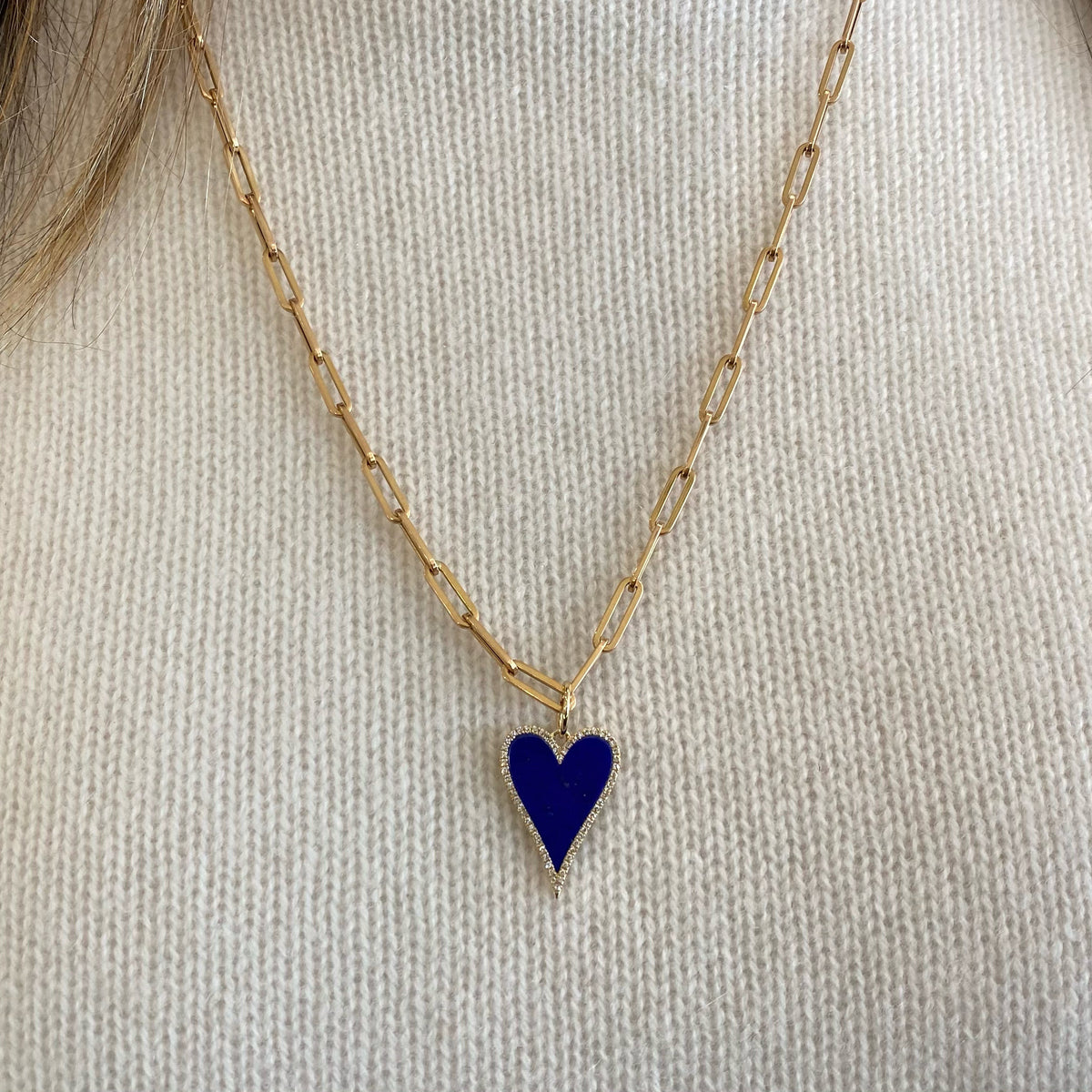 Female model wearing Lapis & Diamond Heart Pendant - 14K gold weighing 1.30 grams - 58 round diamonds totaling 0.15 carats - Lapis.