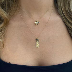 Female Model Wearing Diamond “Mom” Dog Tag And Tiny Heart  Pendant  - 14K gold  - diamonds totaling 0.10 carats