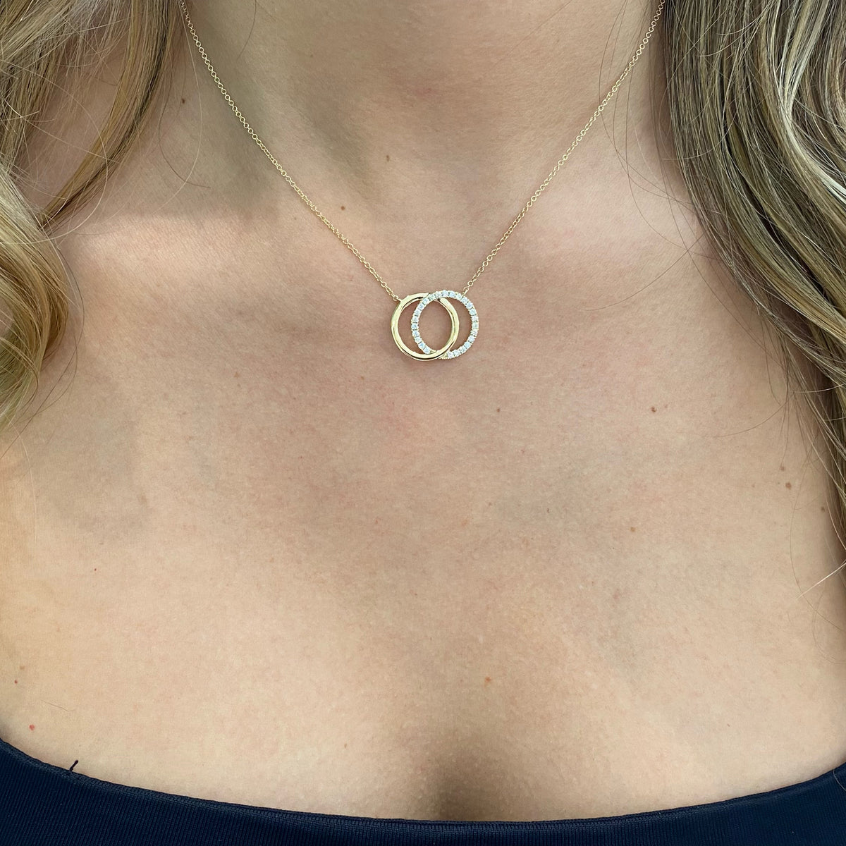 Female model wearing Diamond & Gold Interlocking Circles Necklace - 14K yellow gold - diamonds totaling 0.31 carats