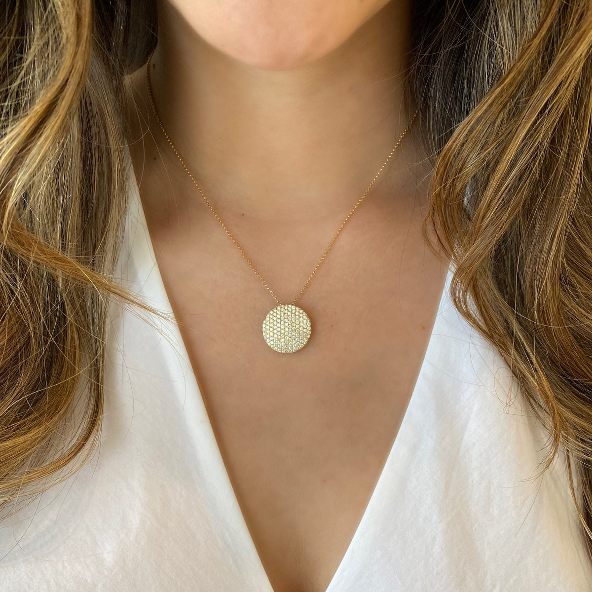 Female Model Wearing Diamond Large Disc Pendant  - 14K gold weighing 4.63 grams  - 155 round diamonds totaling 1.80 carats