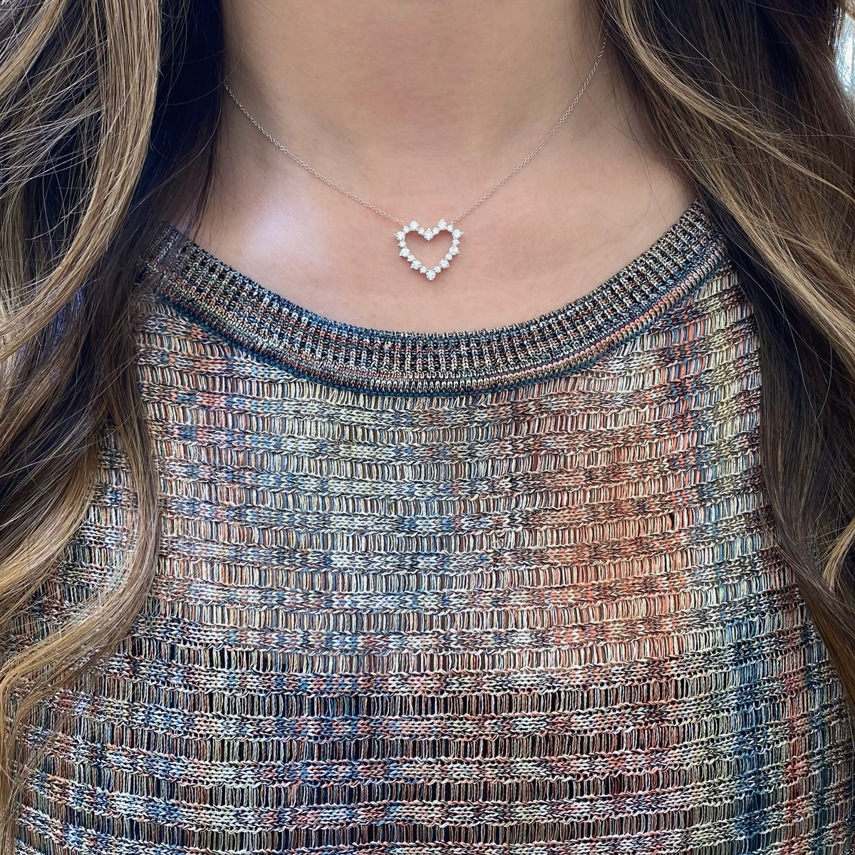 Female Model Wearing Diamond Open Heart Pendant  - 14K gold weighing 3.43 grams  - 20 round diamonds totaling 1.05 carats