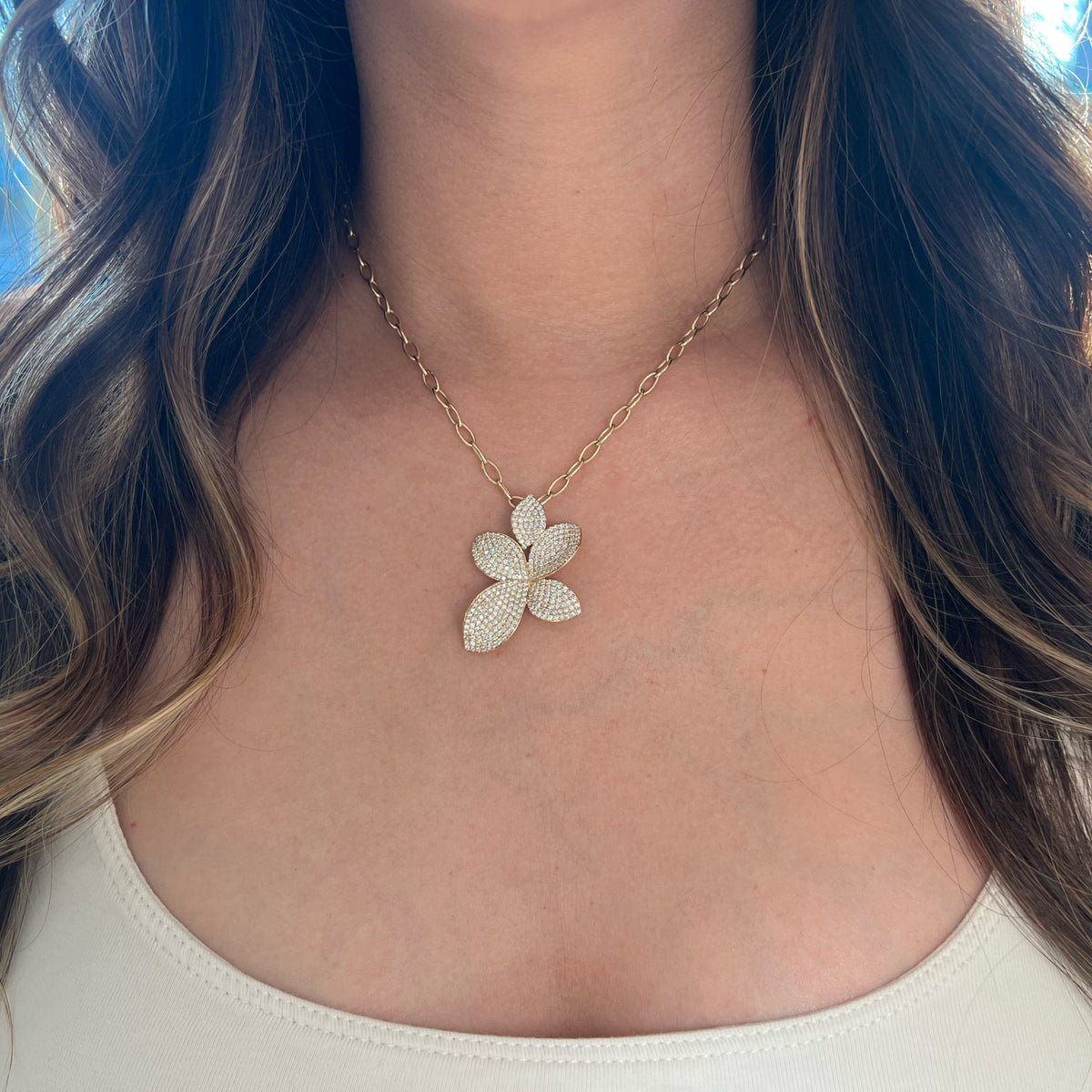Female model wearing Pave Diamond Flower Petals Pendant -14K gold weighing 8.0 grams  -333 round diamonds weighing 2.62  carats